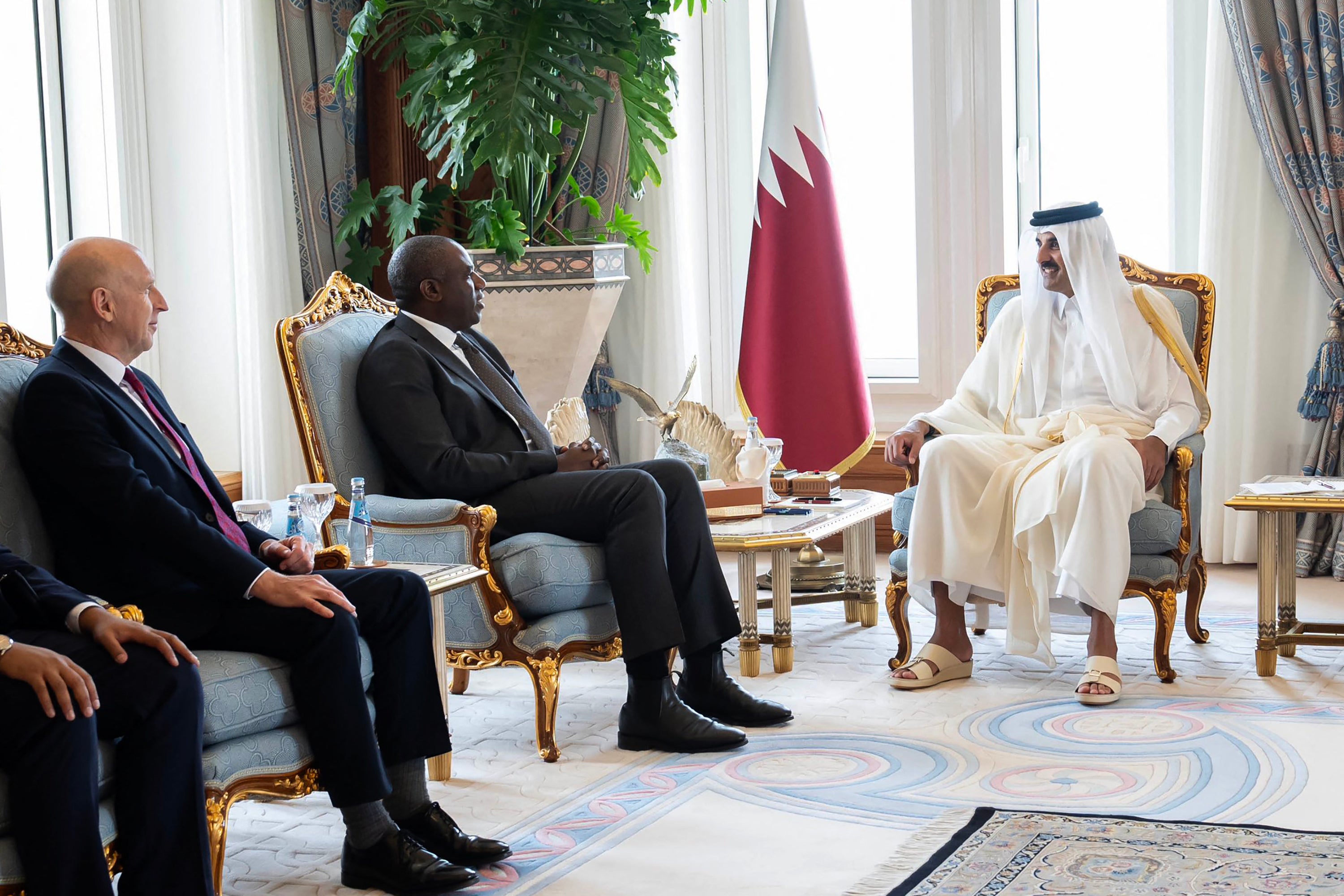 Qatar's Amir Sheikh Tamim bin Hamad al-Thani (R) meeting with Britain's Minister of Foreign Affairs David Lammy (2ndL) and Britain's Minister of Defence John Healey at the Amiri Diwan in Doha on July 31, 2024