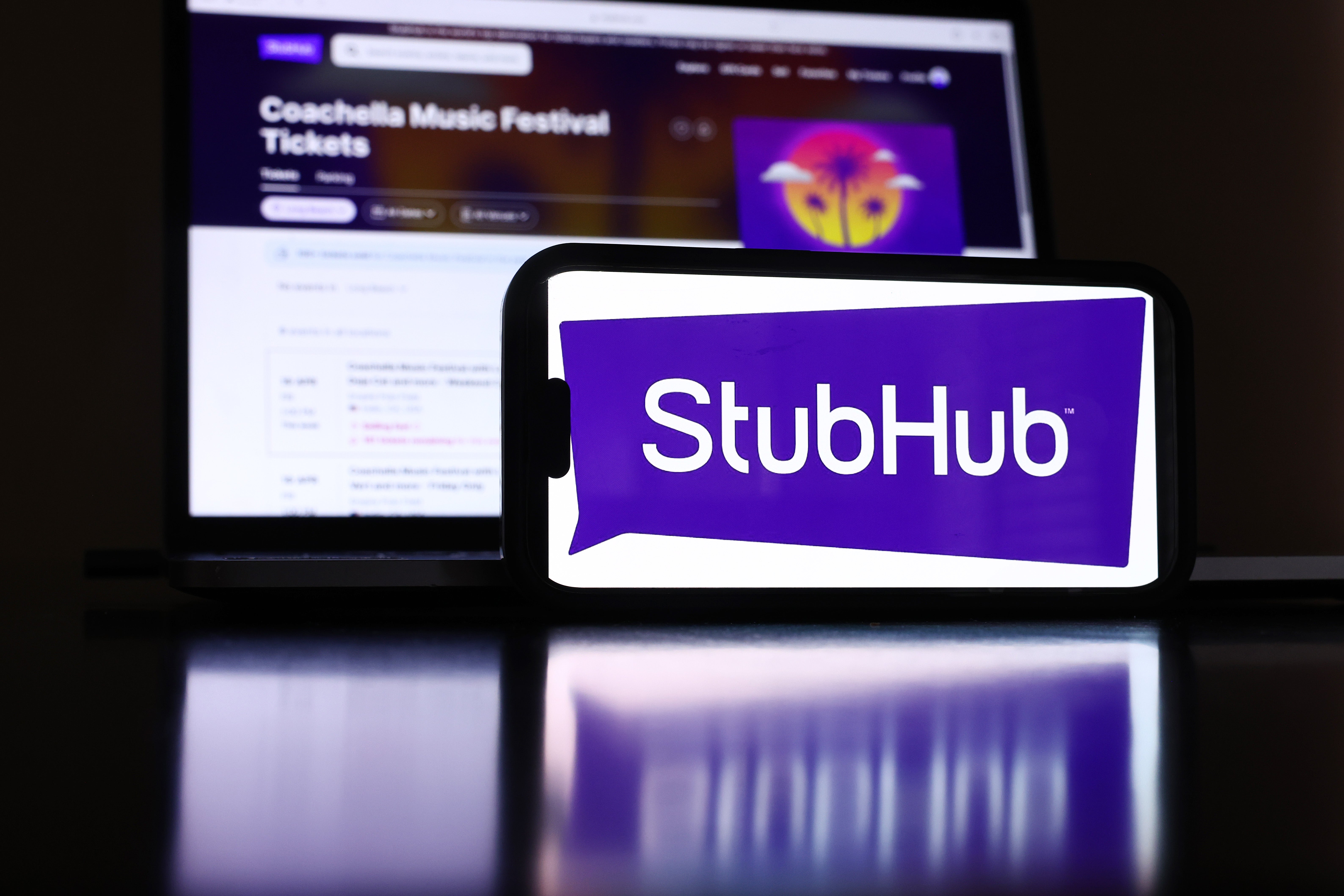 In this photo illustration, the StubHub logo and webpage are displayed on a cell phone and computer monitor on April 17, 2024, in Los Angeles, California. The company is being sued by the DC attorney general for deceptive pricing practices