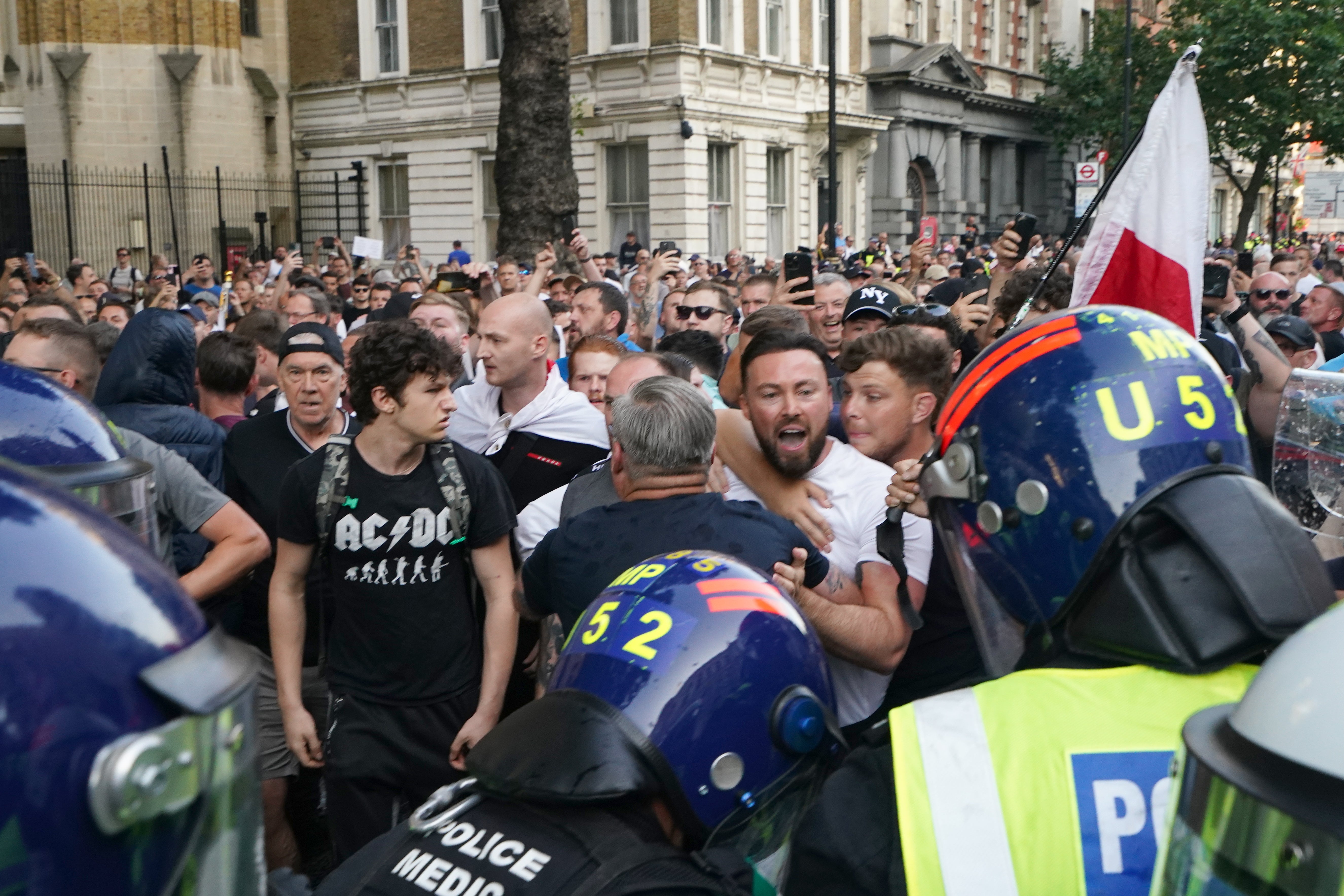 Police officers clash with protesters during the 'Enough is Enough' protest in Whitehall,