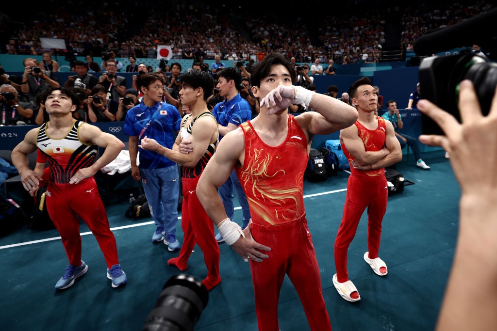 Zhang Boheng waits for his final score to decide the men’s all-around final