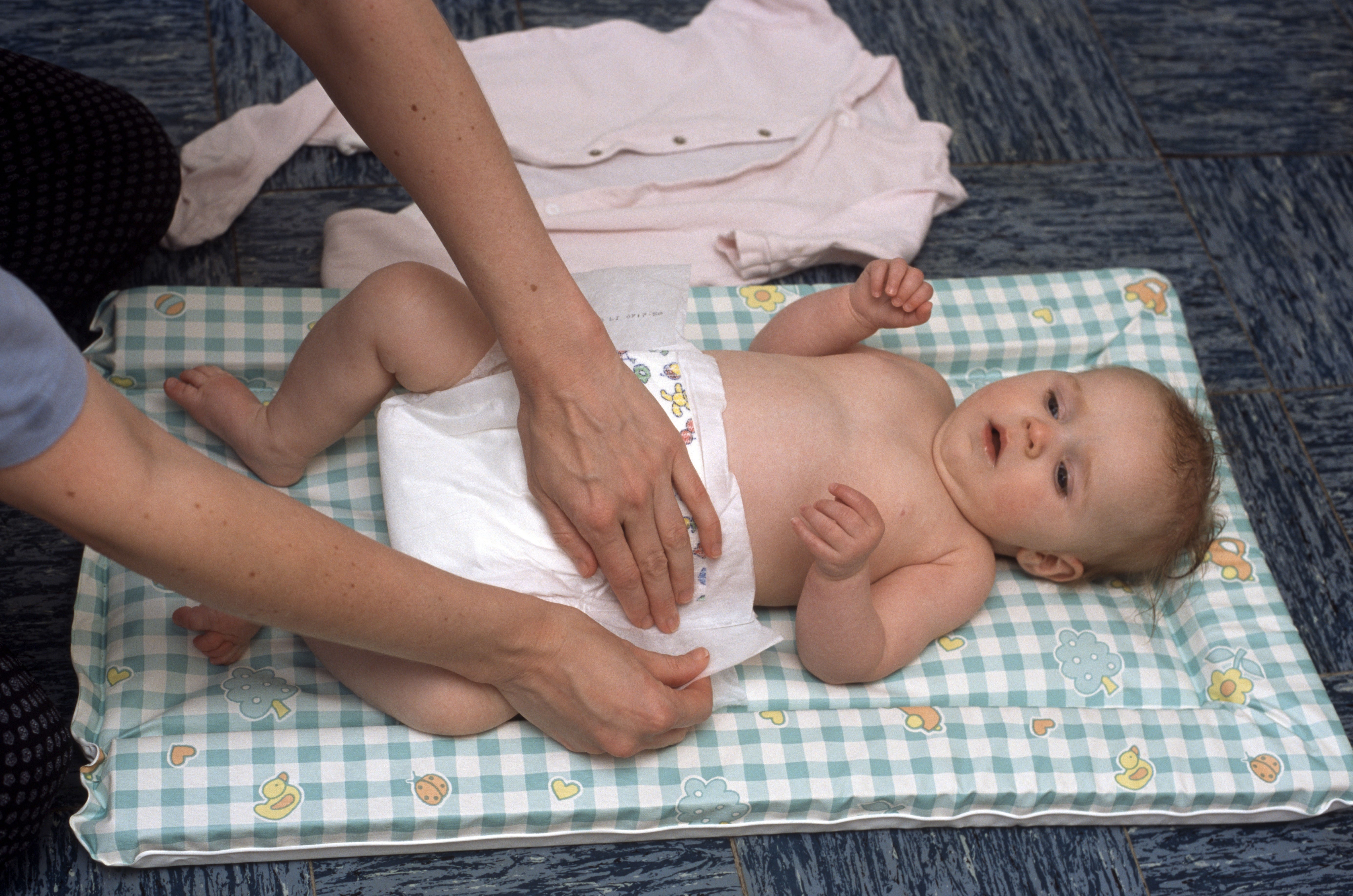 A baby about to have its nappy changed