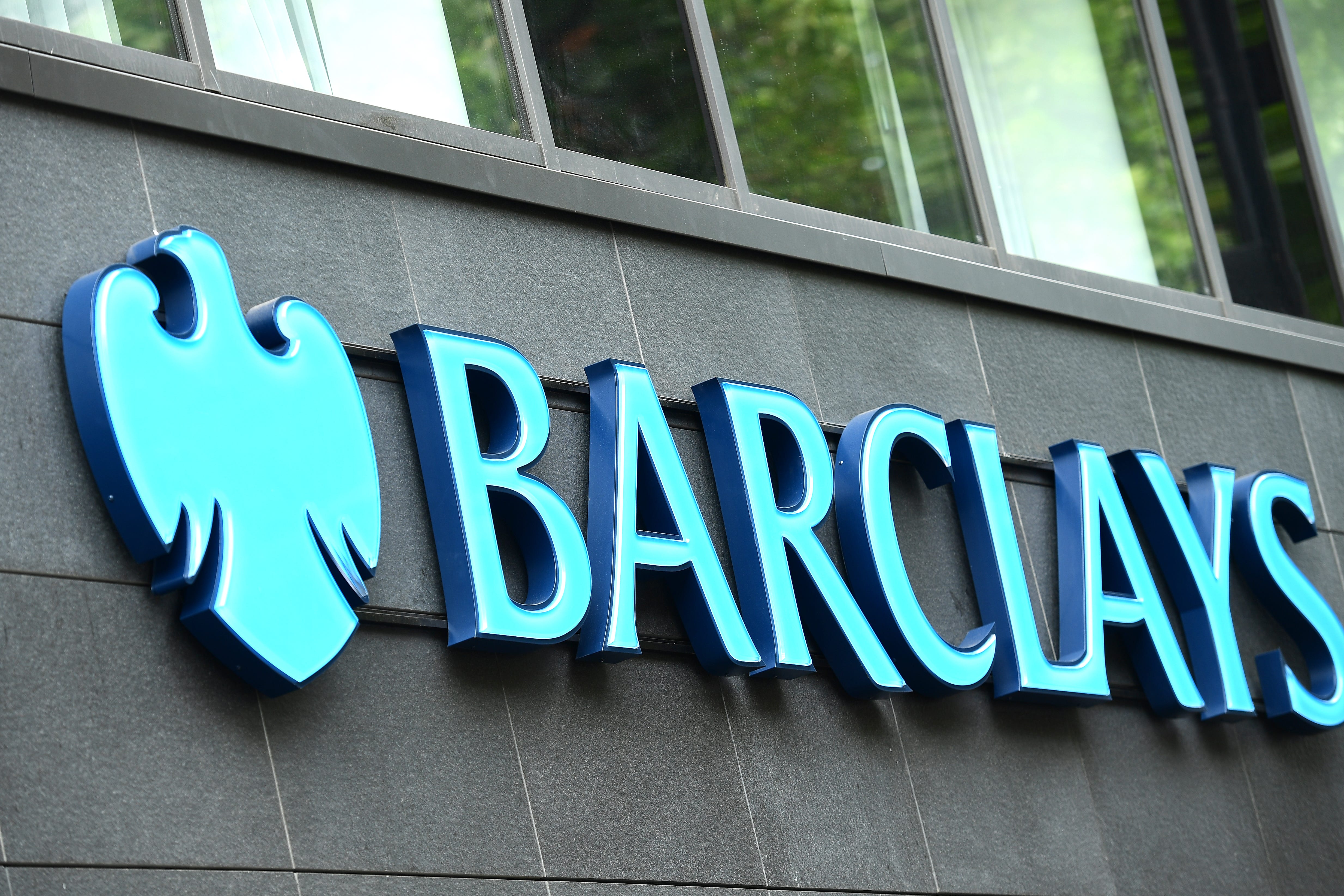 Banking giant Barclays has revealed an 8% drop in half-year profits, but upped its full year outlook for a key performance measure and unveiled more returns for shareholders (Ian West/PA)