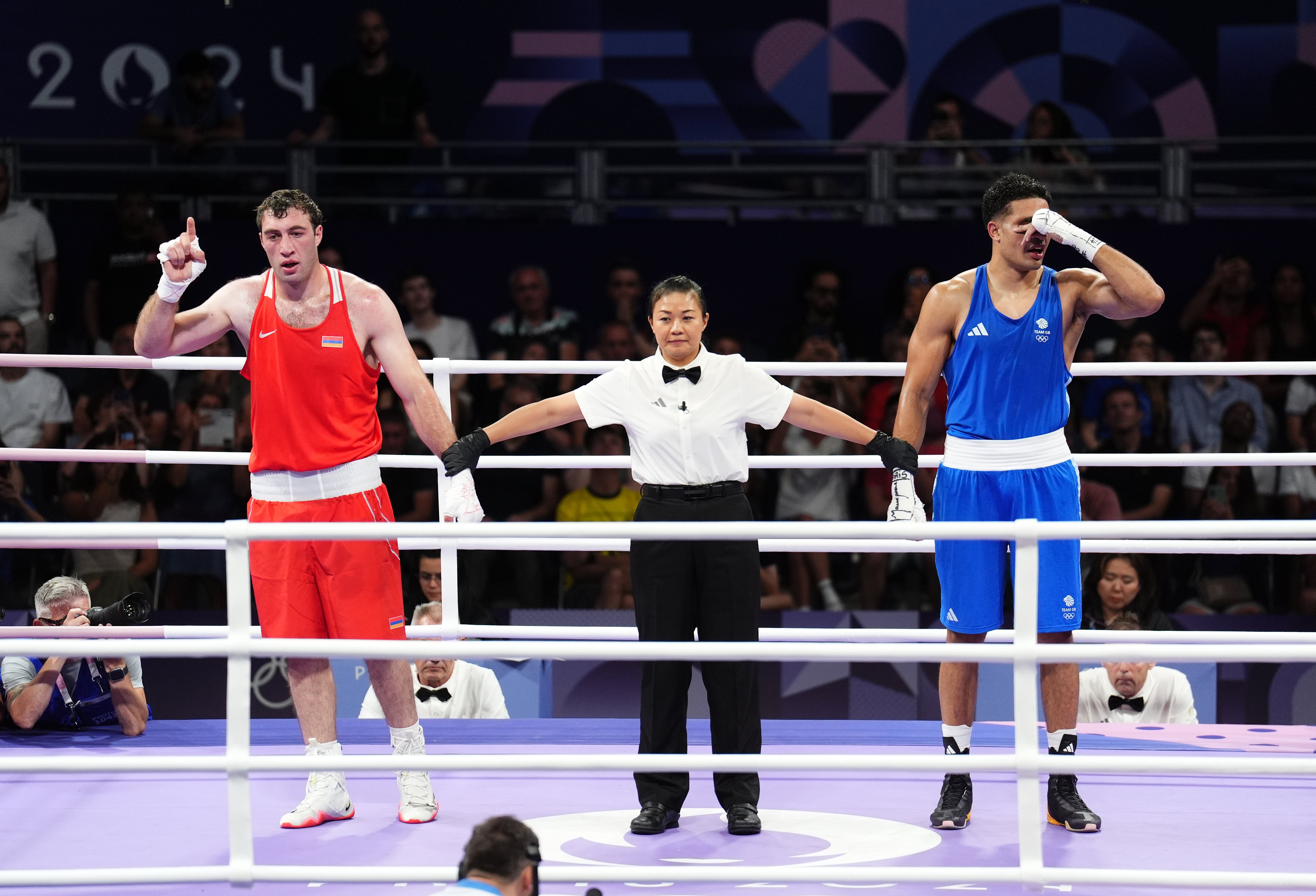 Team GB’s Delicious Orie (right) is one of five British boxer to fail to progress past their first fights in Paris