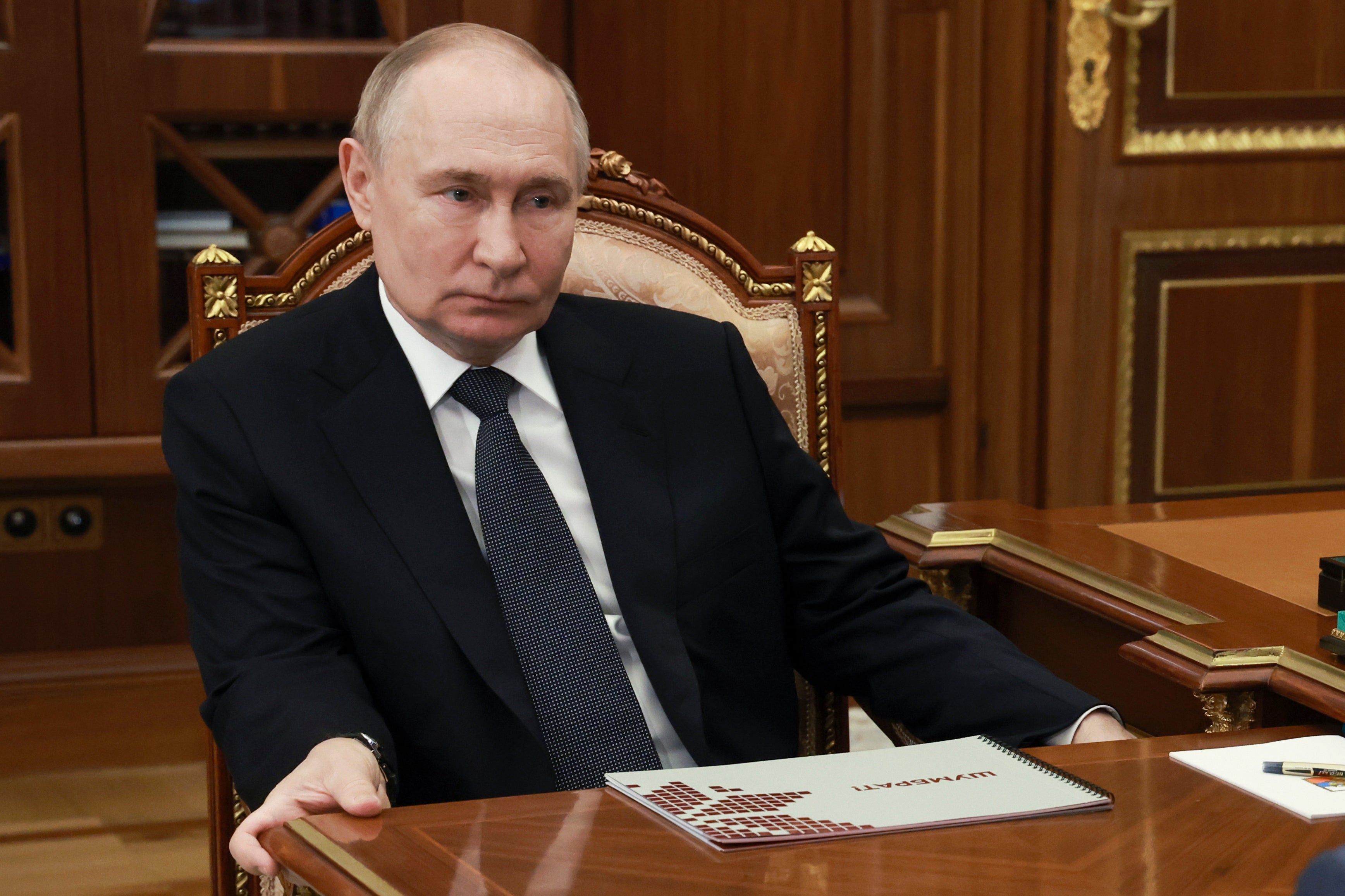 Russia Russian President Vladimir Putin listens to the head of the Republic of Mordovia Artem Zdunov during their meeting at the Kremlin in Moscow, Russia, Thursday, Aug. 1, 2024