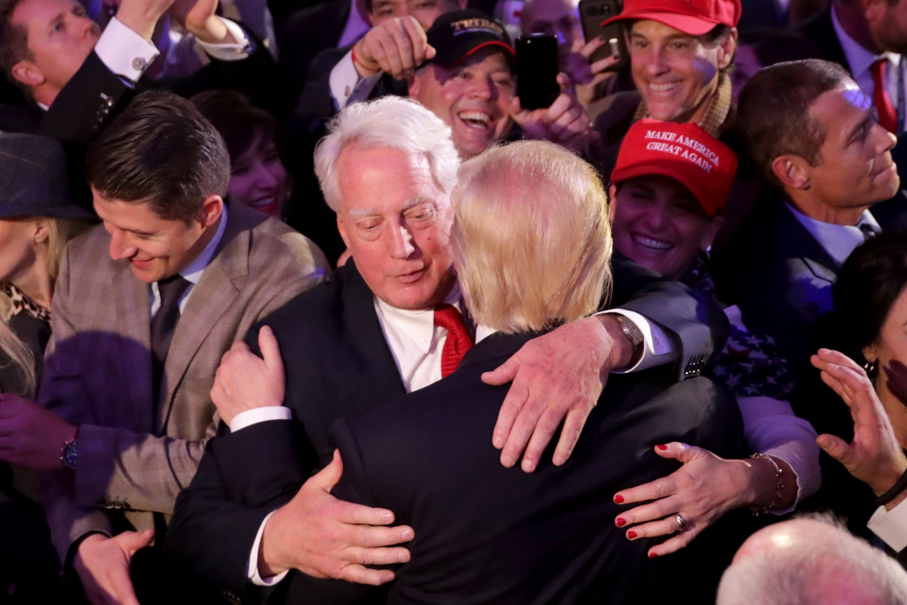 Donald Trump (R) hugs his brother Robert Trump after delivering his acceptance speech at the New York Hilton Midtown in the early morning hours of November 9, 2016