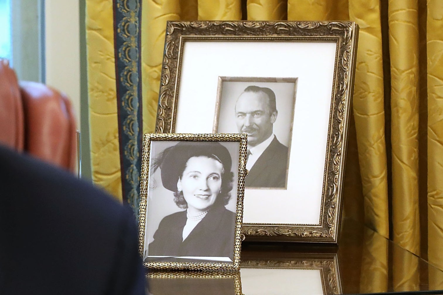 Framed photographs of Donald Trump's parents, Fred and Mary Trump, sat on a table in the Oval Office