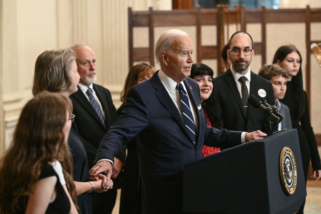 Joe Biden speaks with family members of freed Russian prisoners in the White House state dinner room on August 1 ahead of the departure of their loved ones from Turkey