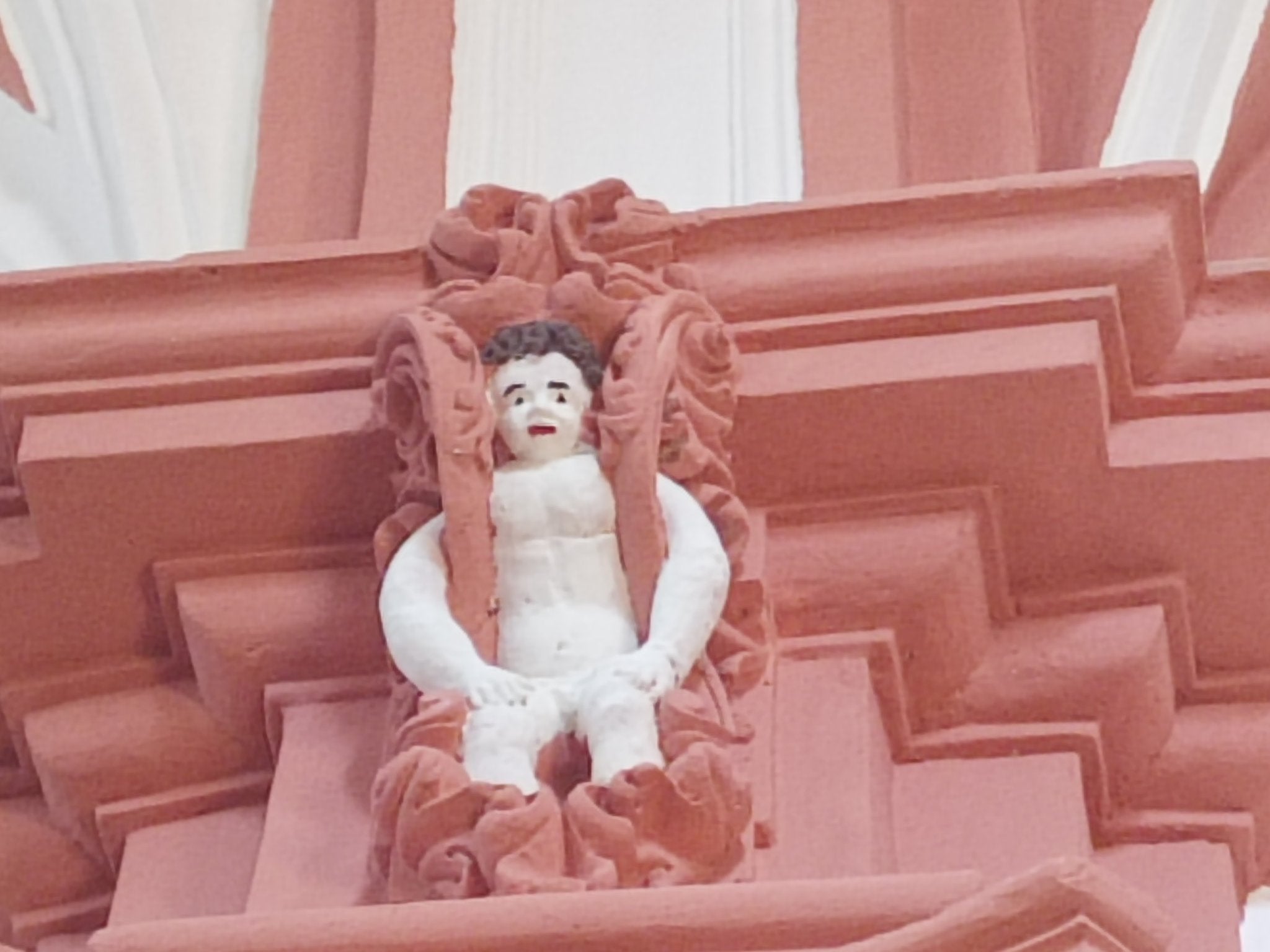 A cherubim seen inside an 18th century Spanish church after renovations