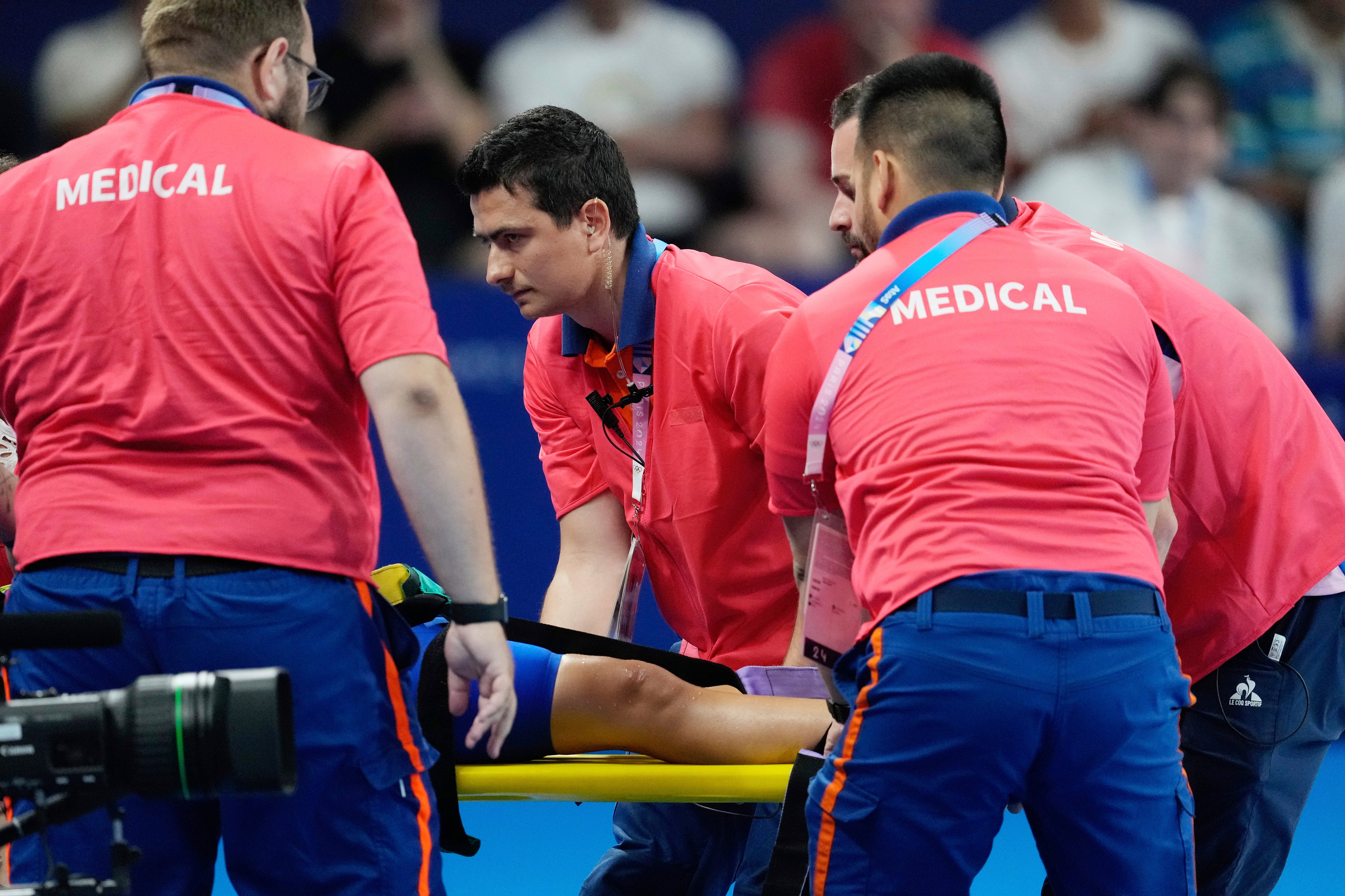 Members of the medical team carry Slovakia's Tamara Potocka