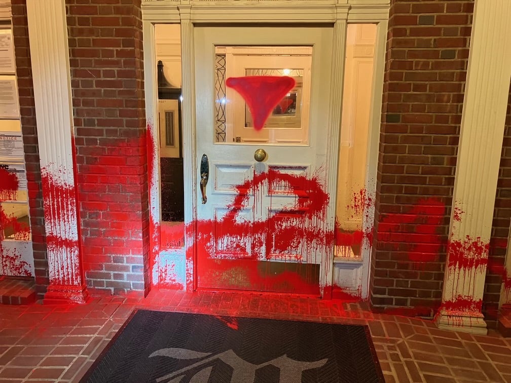 An inverted red triangle was sprayed on the windows and doors of the Brooklyn Museum’s director’s home. A suspect has been arrested on a hate crime charge over a month after the incident