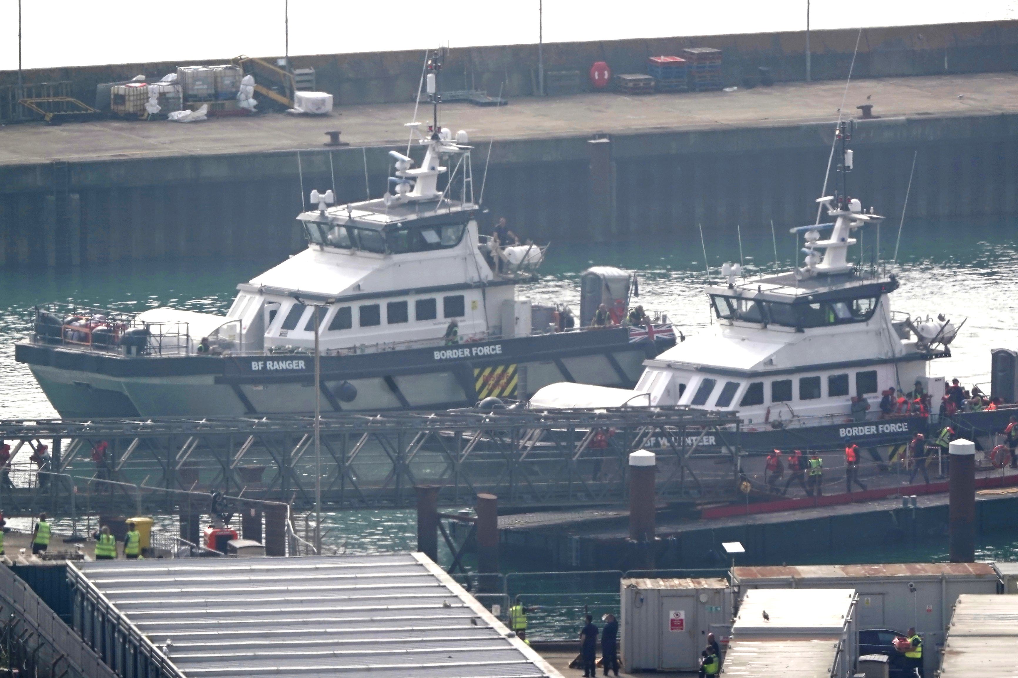 A group of people thought to be migrants are brought in to Dover, Kent, from a Border Force vessel following a small boat incident in the Channel (Gareth Fuller/PA)