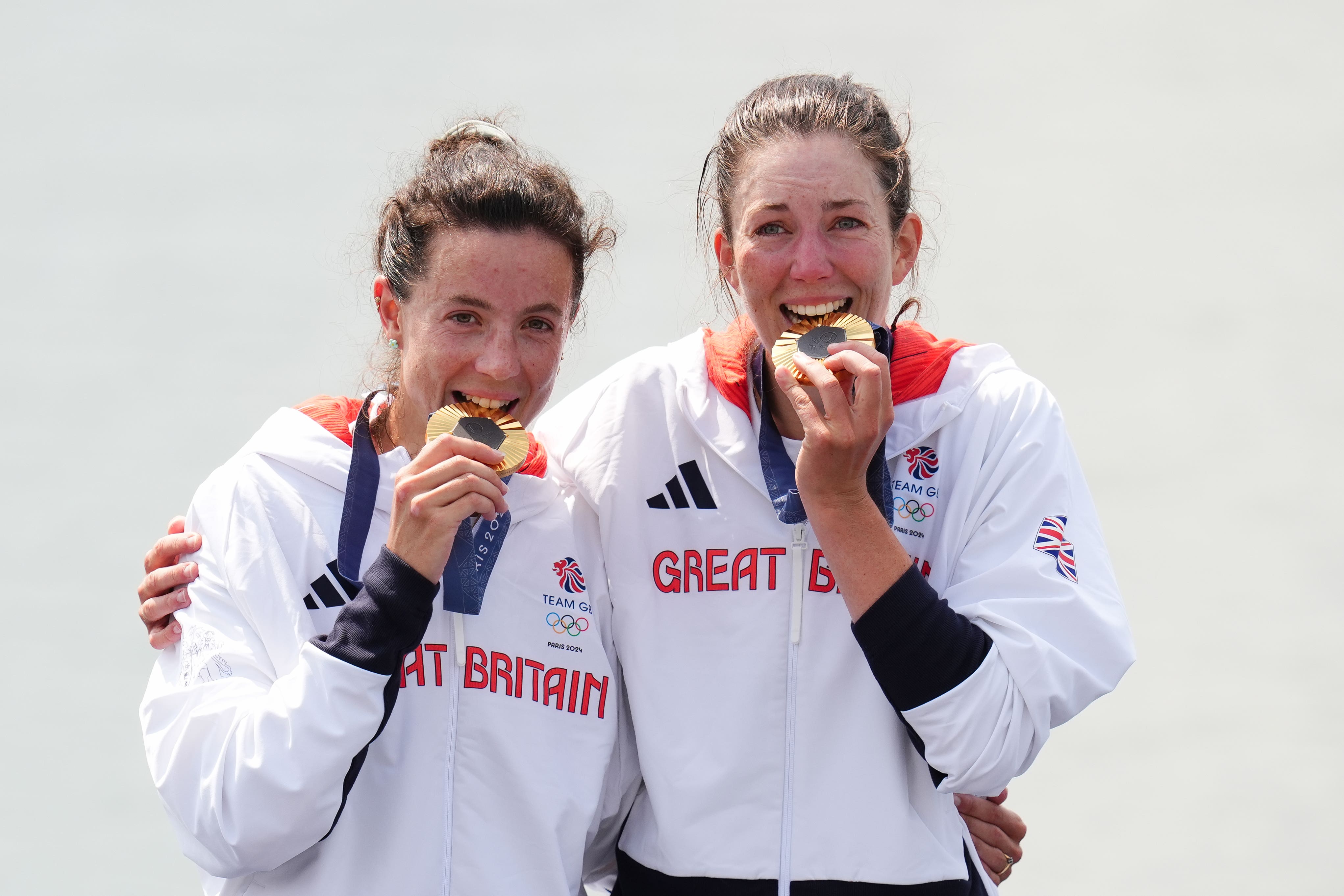 Great Britain’s Emily Craig (right) and Imogen Grant celebrate winning gold at the women’s lightweight double sculls at the Paris Olympics (John Walton/PA)