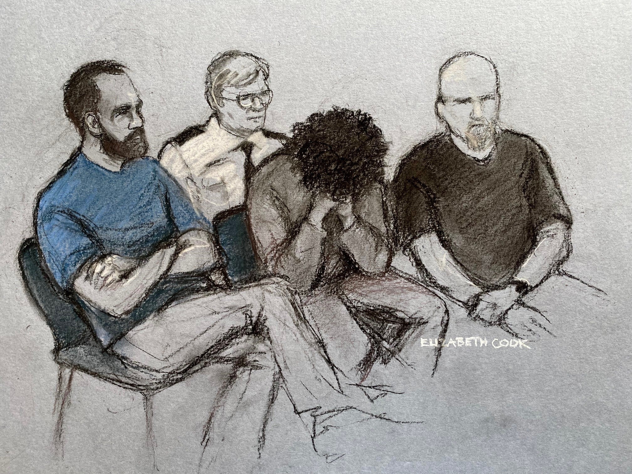 Court artist drawing of 17-year-old Rudakubana, centre, covering his face as he appeared in the dock at Liverpool Crown Court