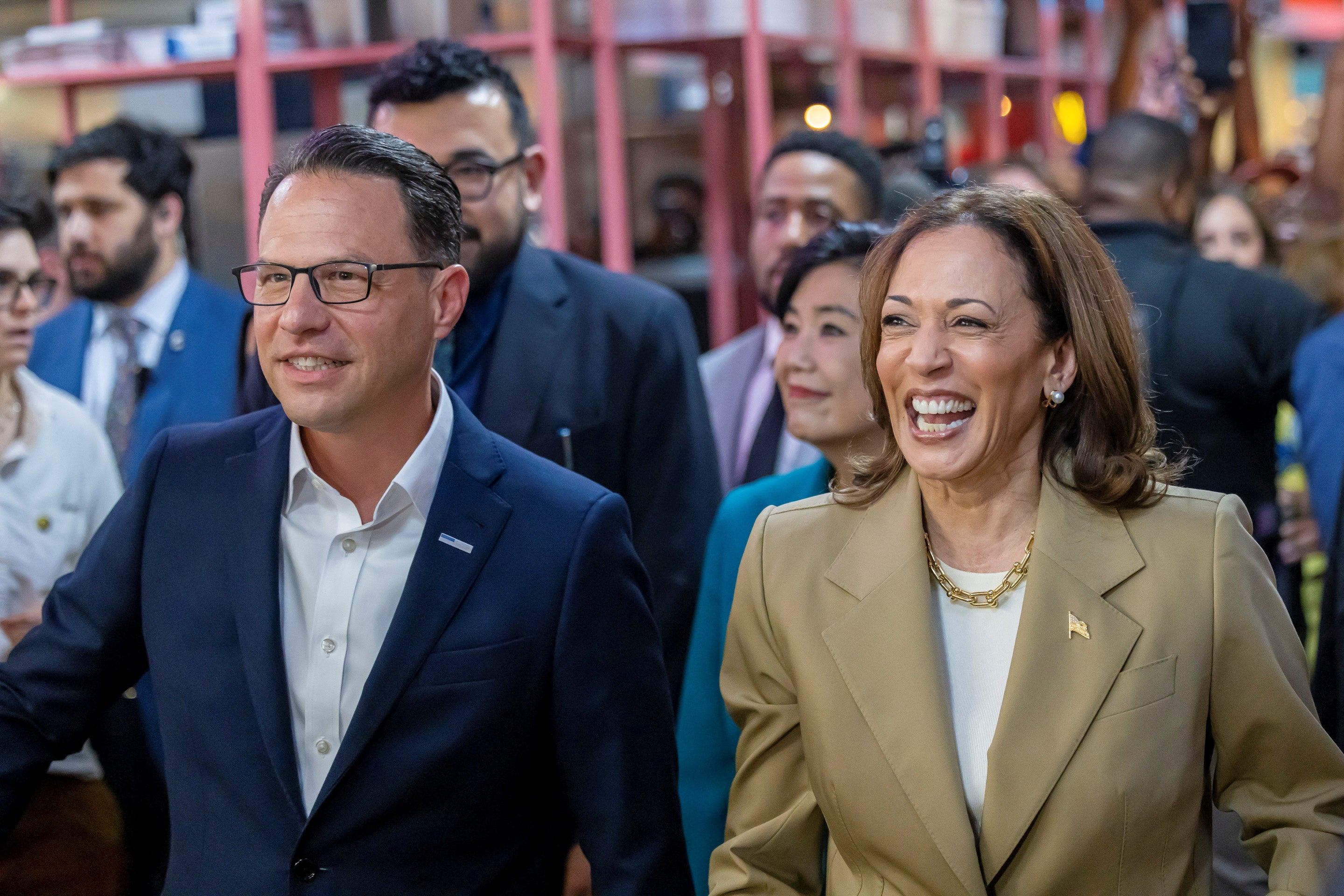 Vice President Kamala Harris and Pennsylvania Governor Josh Shapiro, who is considered to be one of Harris’ top running mate picks, visit the Reading Terminal Market in Philadelphia in July