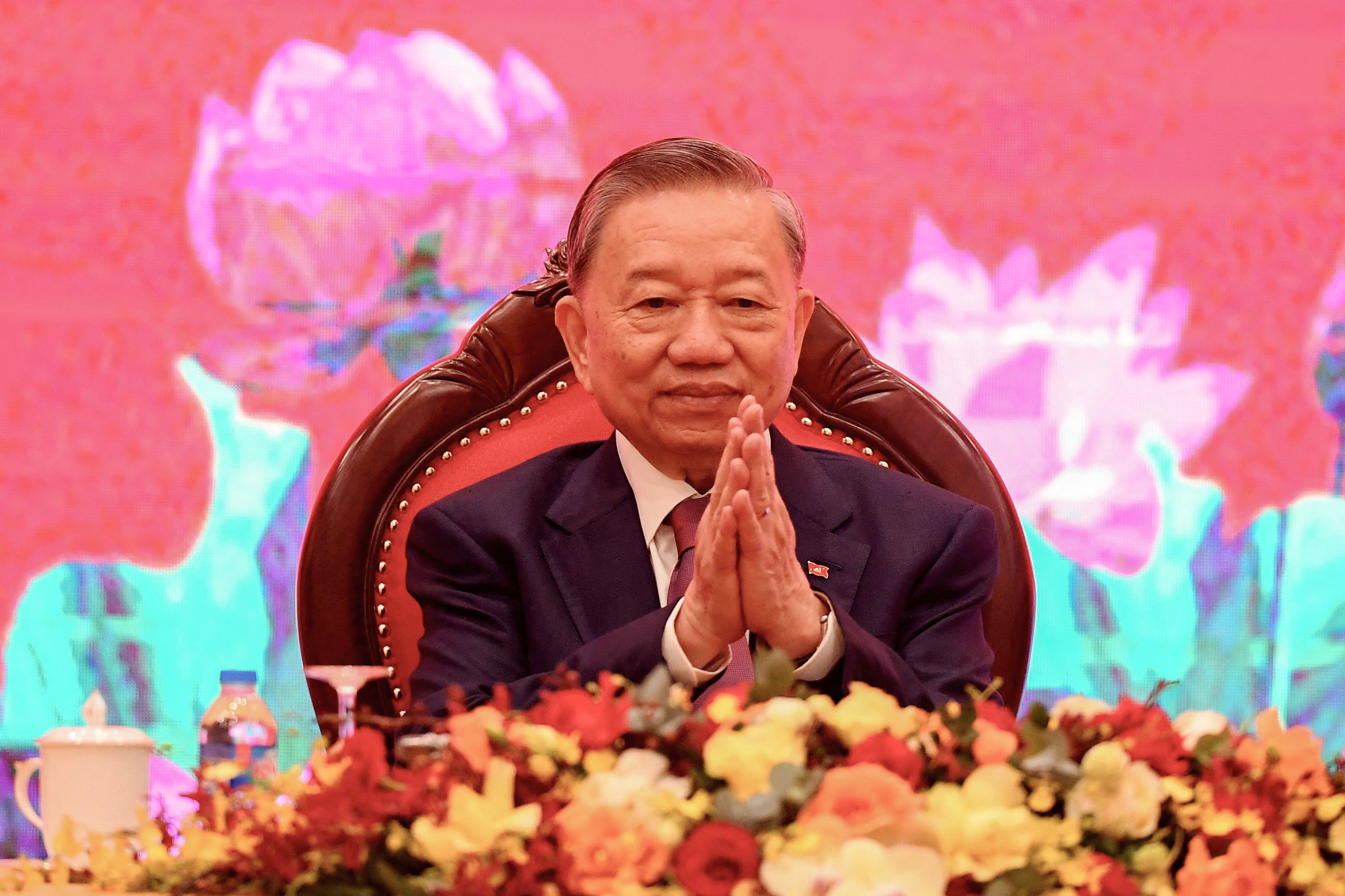 President To Lam attends a press conference at the National Convention Center in Hanoi