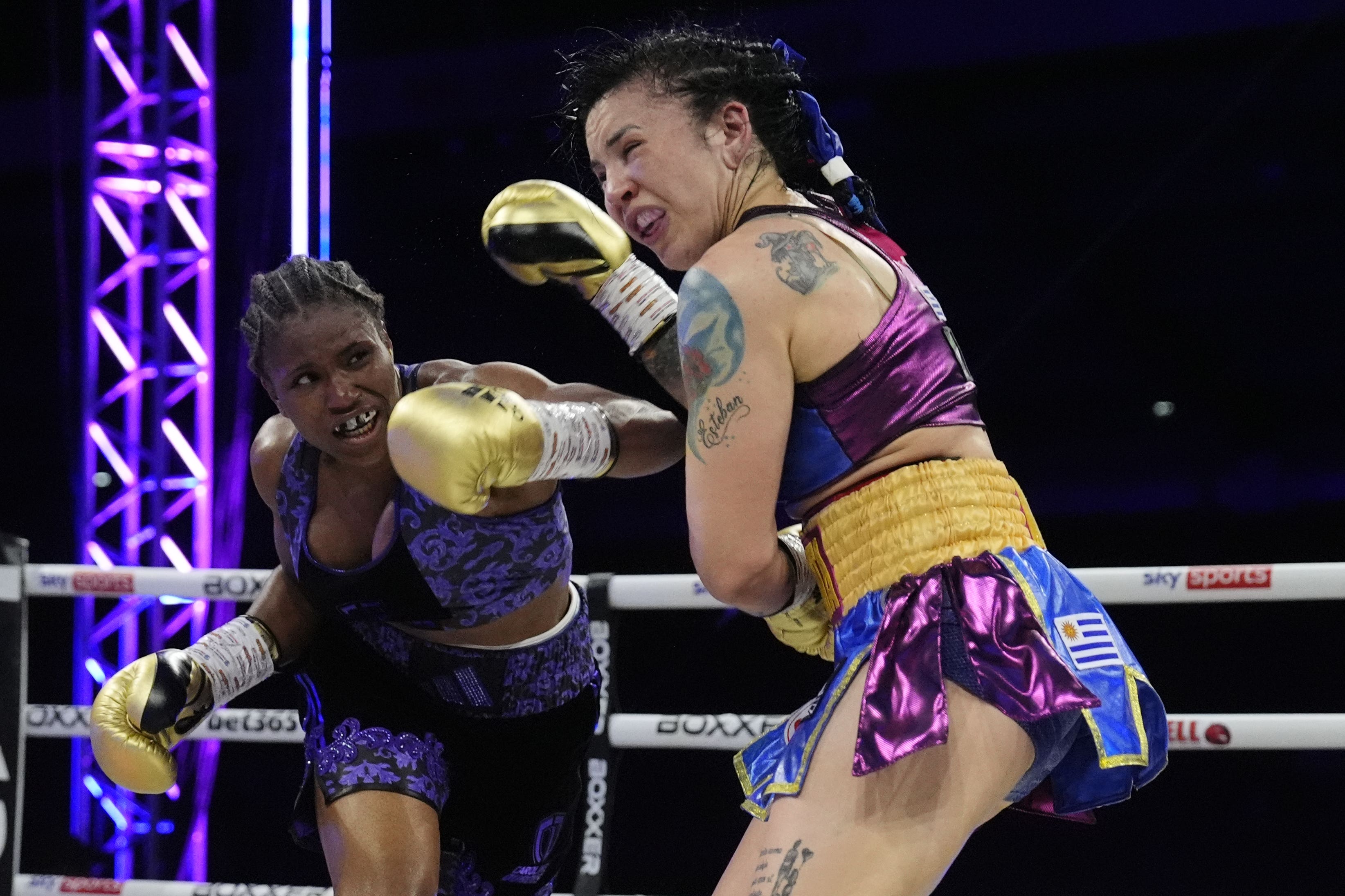 Caroline Dubois lands a big left on the chin of Maira Moneo (Nick Potts/PA)