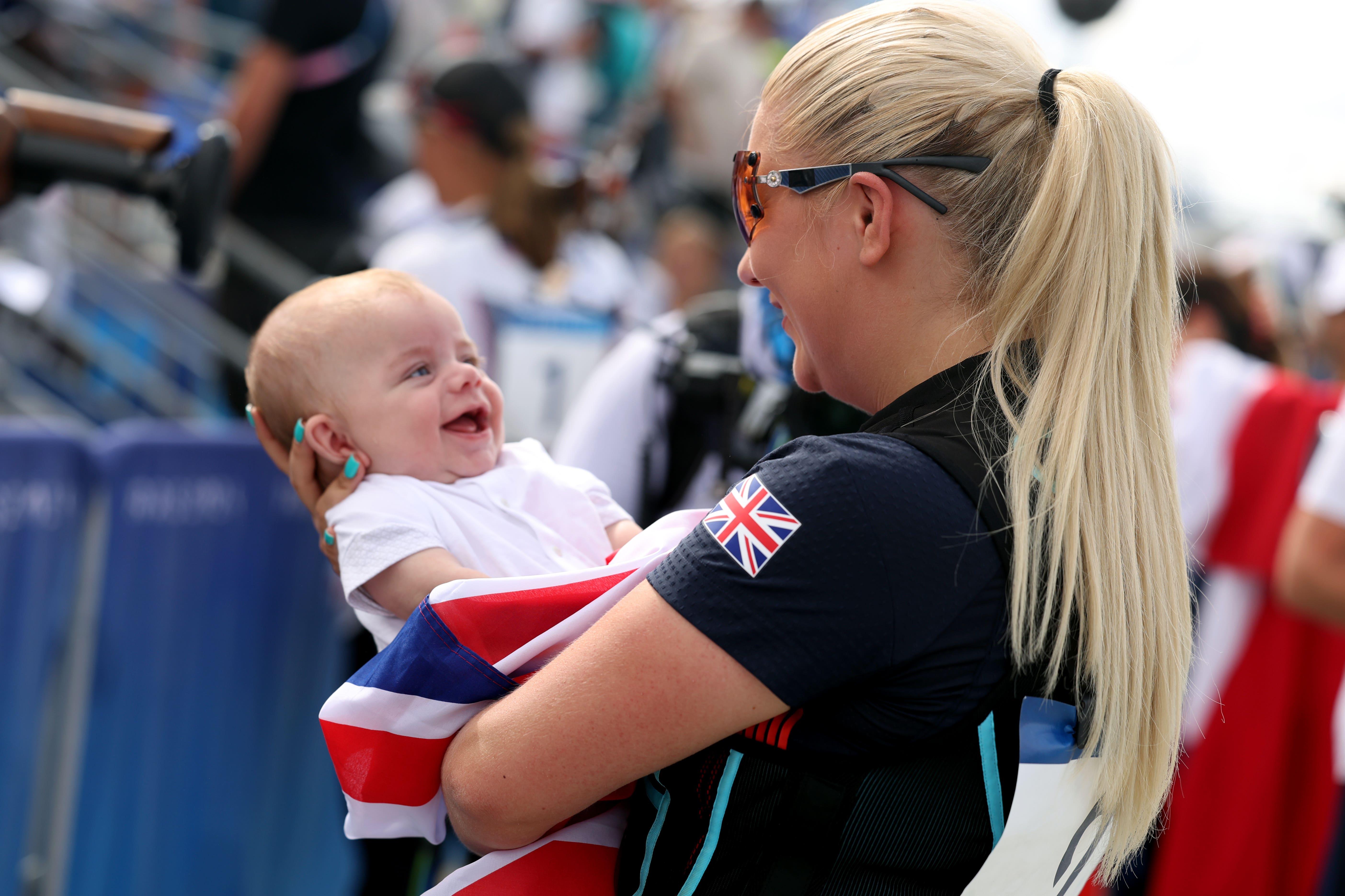 Amber Rutter pictured with son Tommy after winning women’s skeet silver for Great Britain (Isabel Infantes/PA).