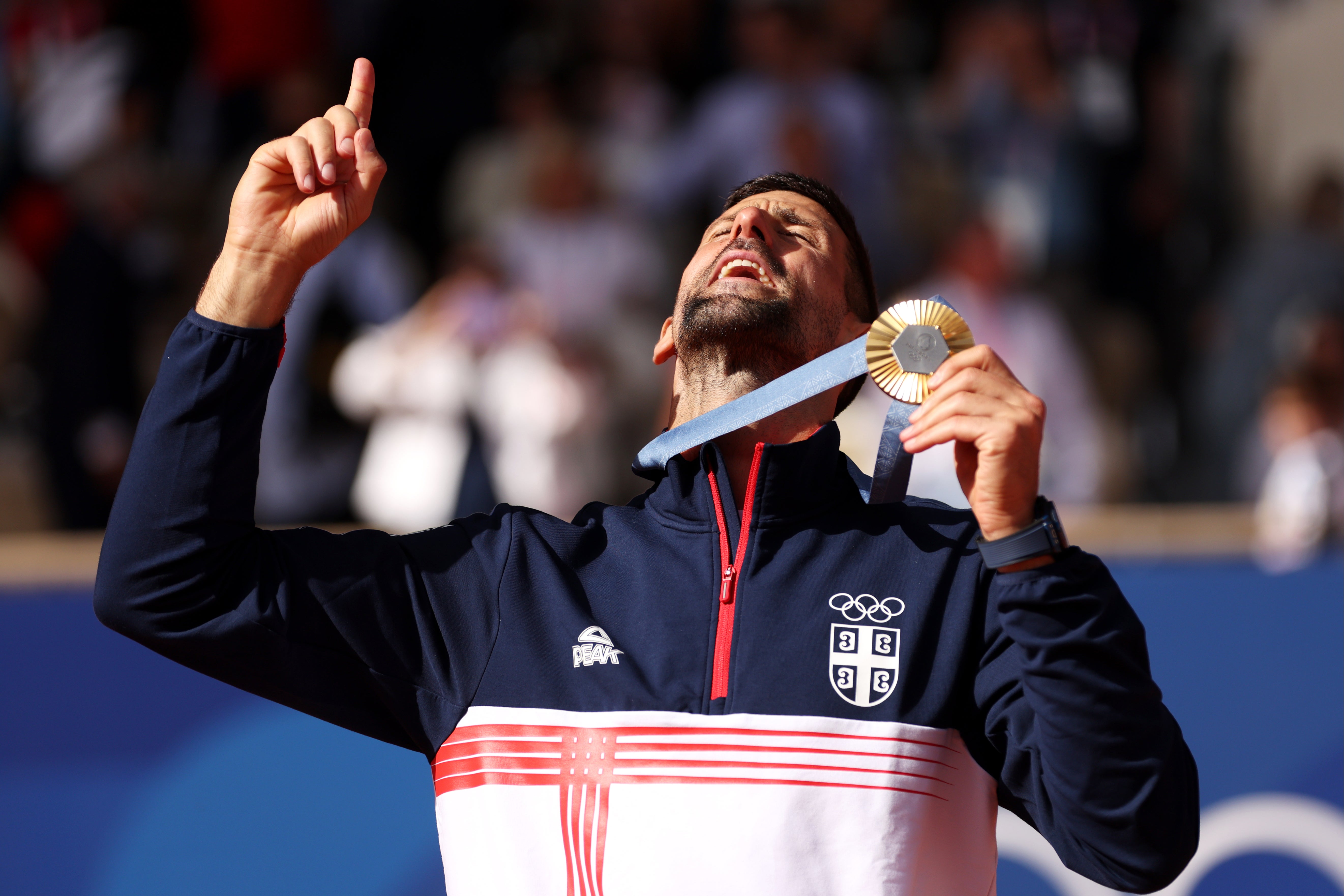 Winning point: Djokovic looks to the heavens on the podium