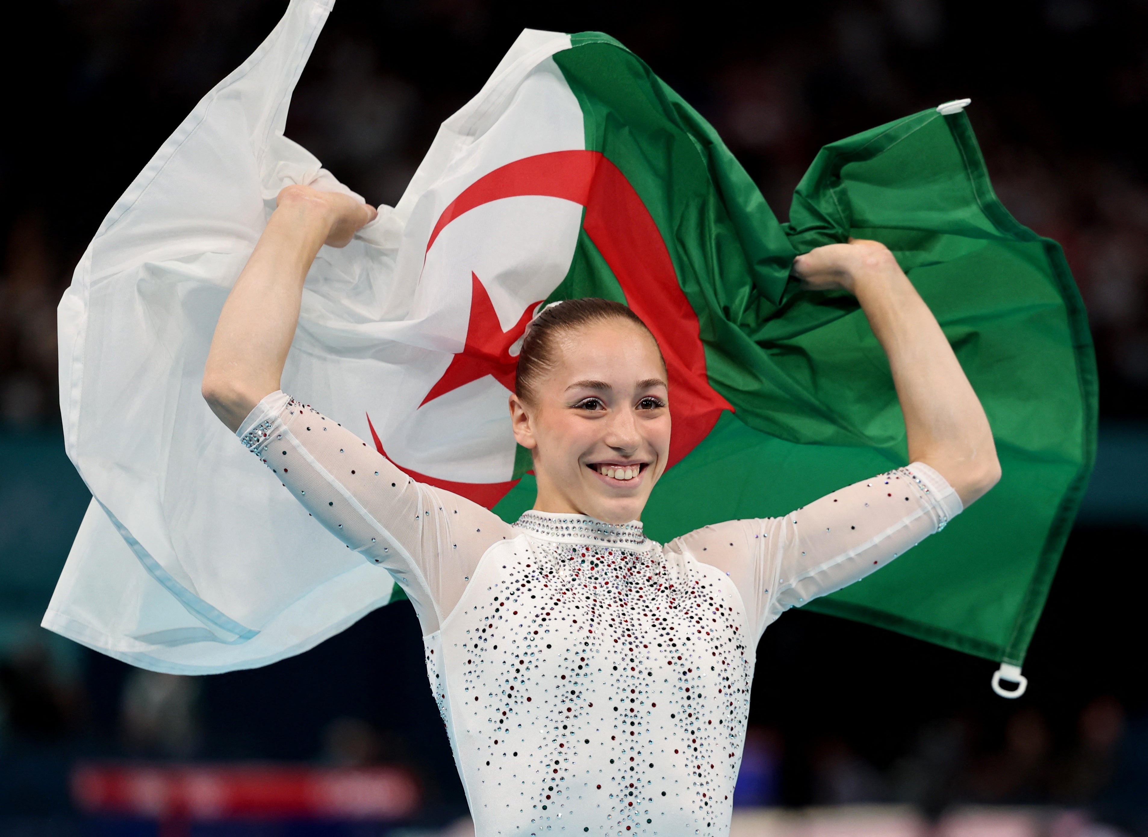 Kaylia Nemour celebrates with the Algerian flag