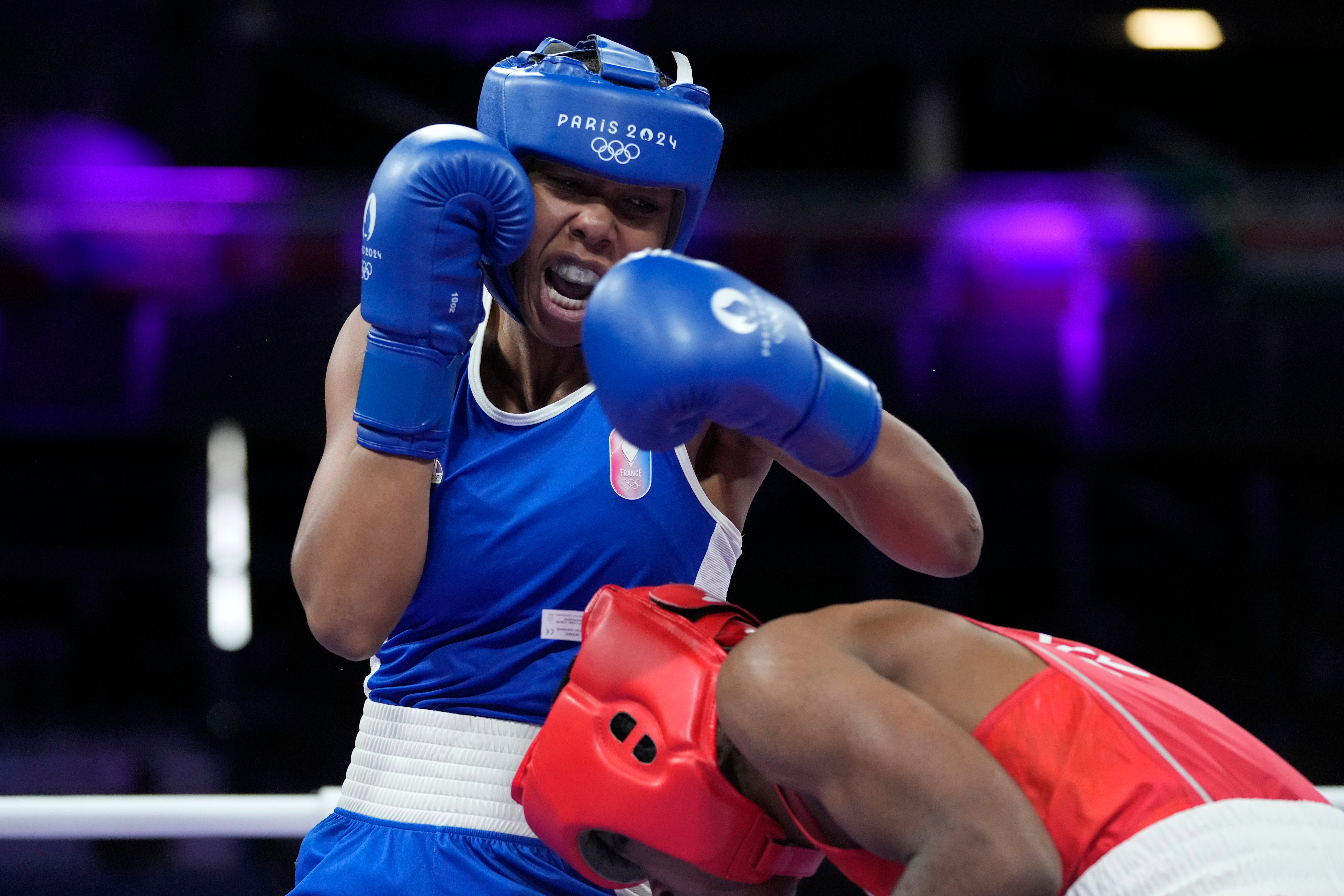 France's Davina Michel, left, fights Refugee Olympic Team's Cindy Ngamba