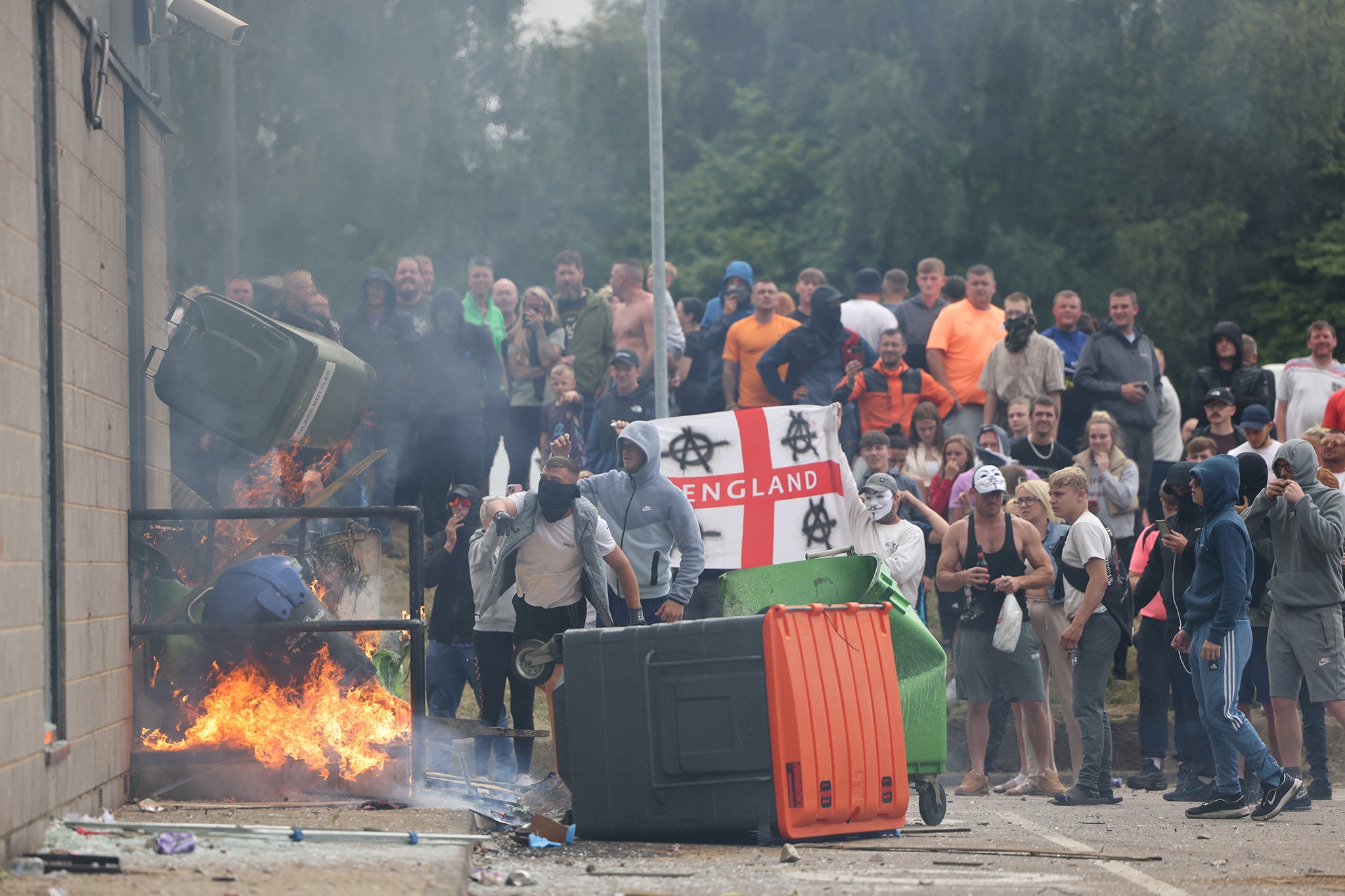 Masked men hurled lengths of wood, chairs and bottles in Rotherham on Sunday