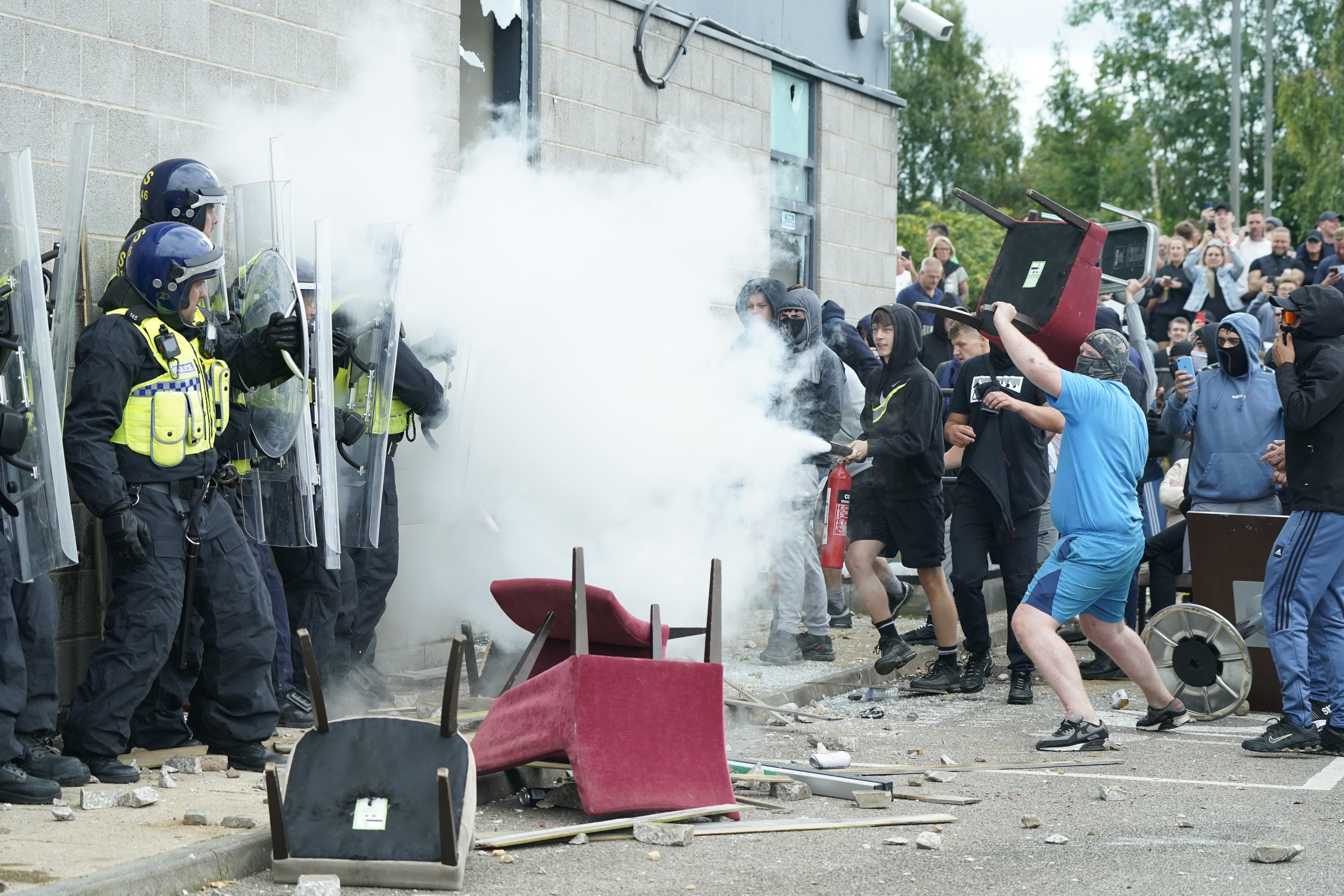 People clash with police officers (Danny Lawson/PA)