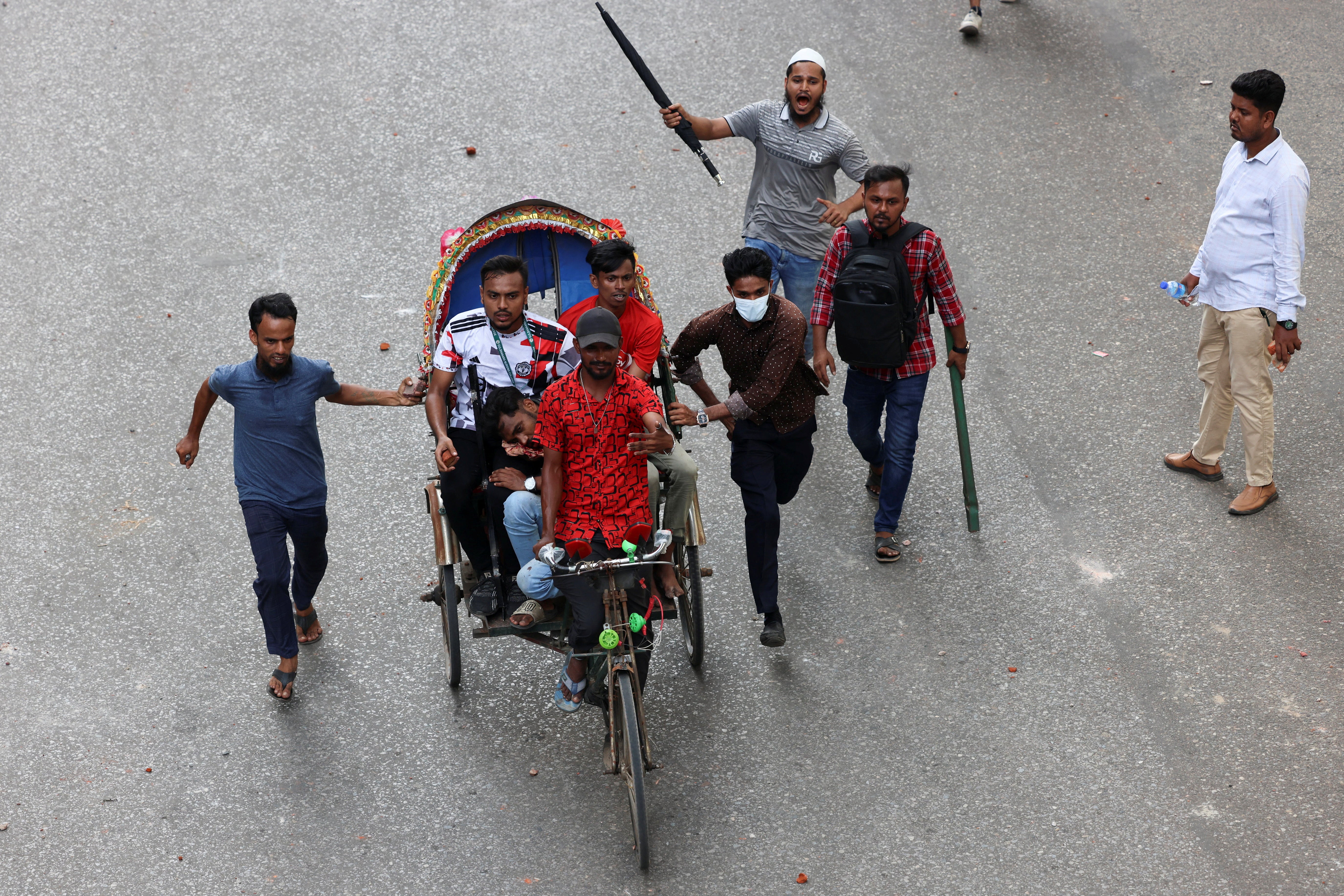 An injured protester is taken to hospital