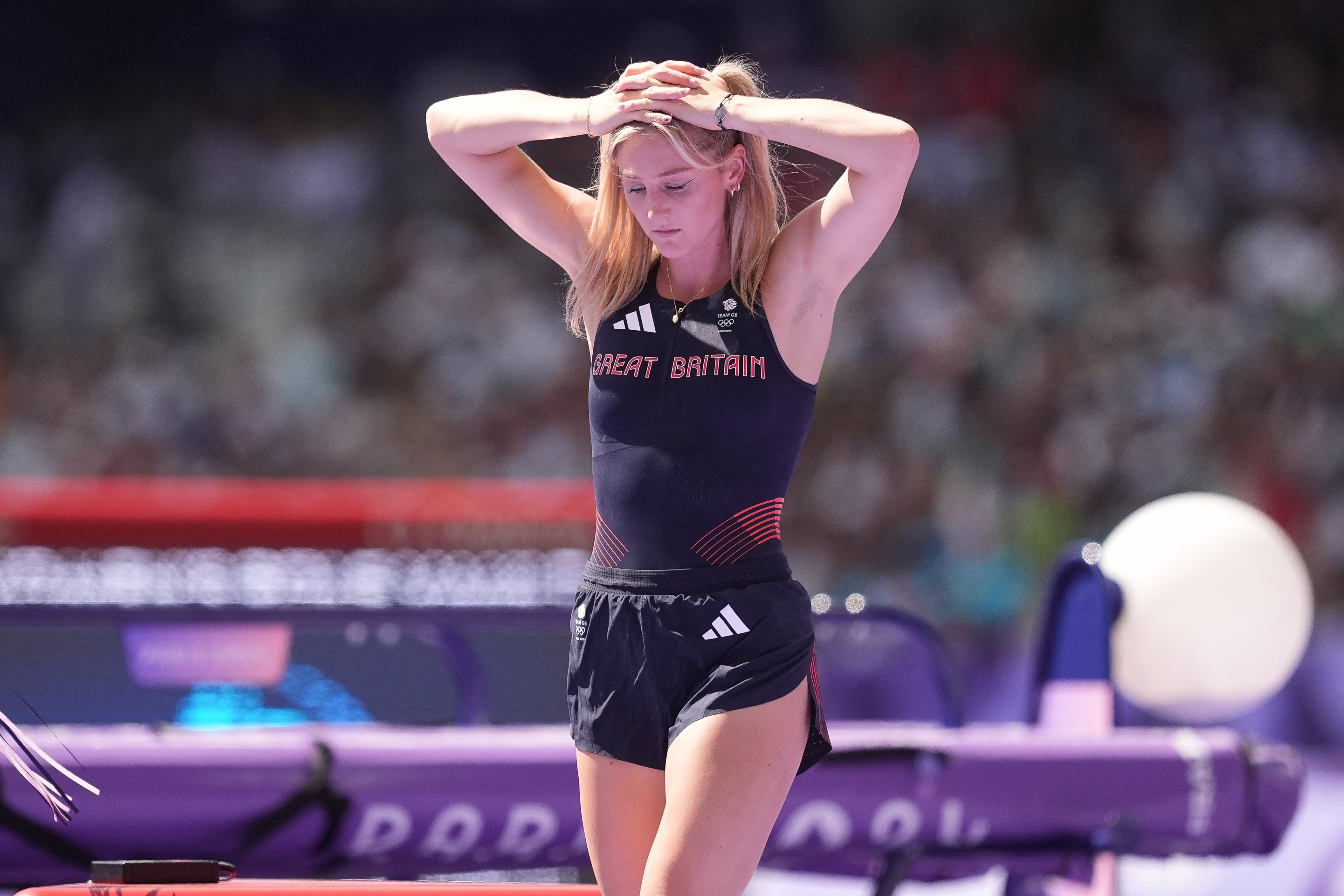 Great Britain’s Molly Caudery holds her head in her hands after failing to qualify for the women’s pole vault final (Martin Rickett/PA).