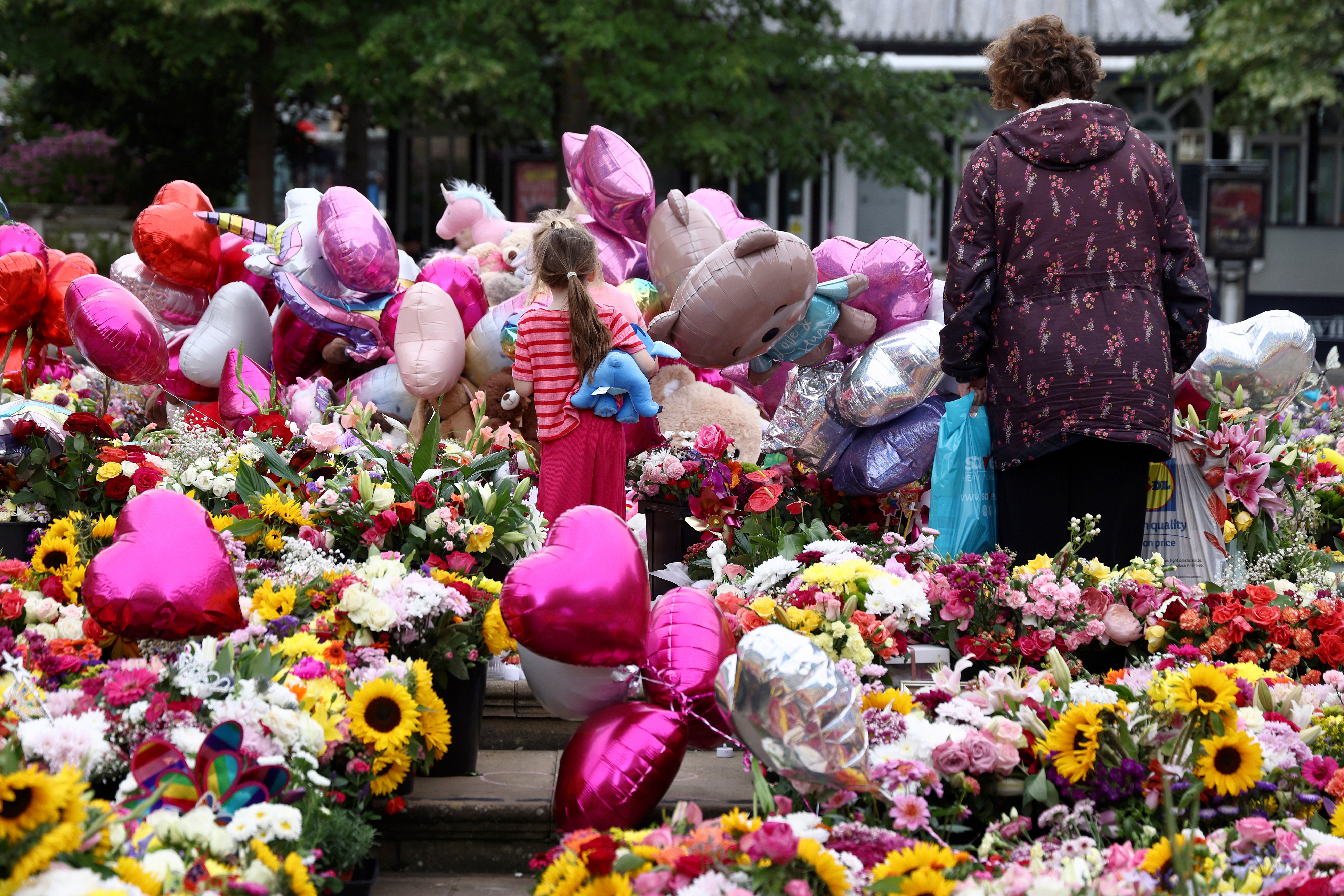 Tributes to six-year-old Bebe King, seven-year-old Elsie Dot Stancombe and Alice Dasilva Aguiar, nine at the town hall