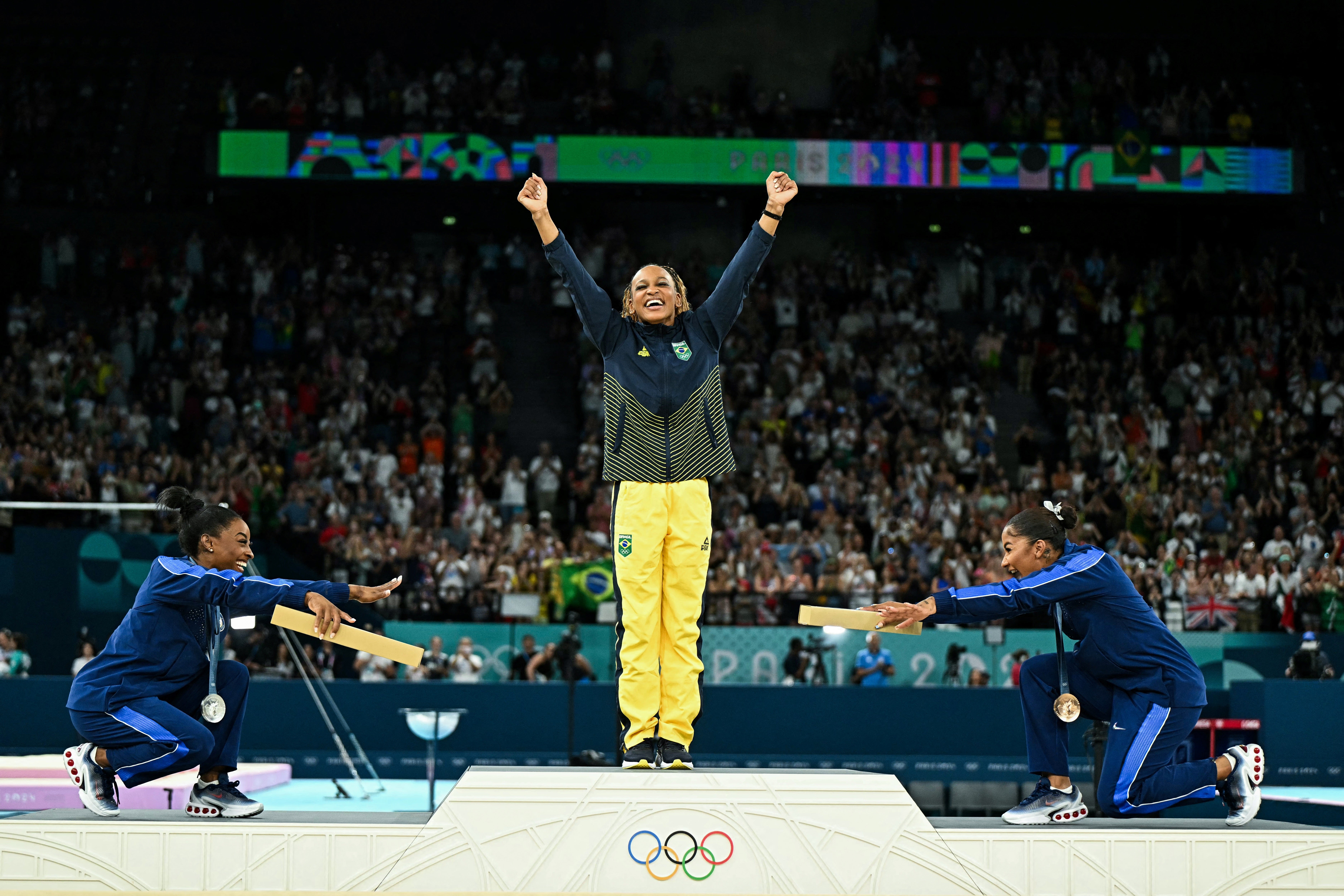 Simone Biles (silver), Rebeca Andrade (gold) and Jordan Chiles (bronze) pose during the podium ceremony