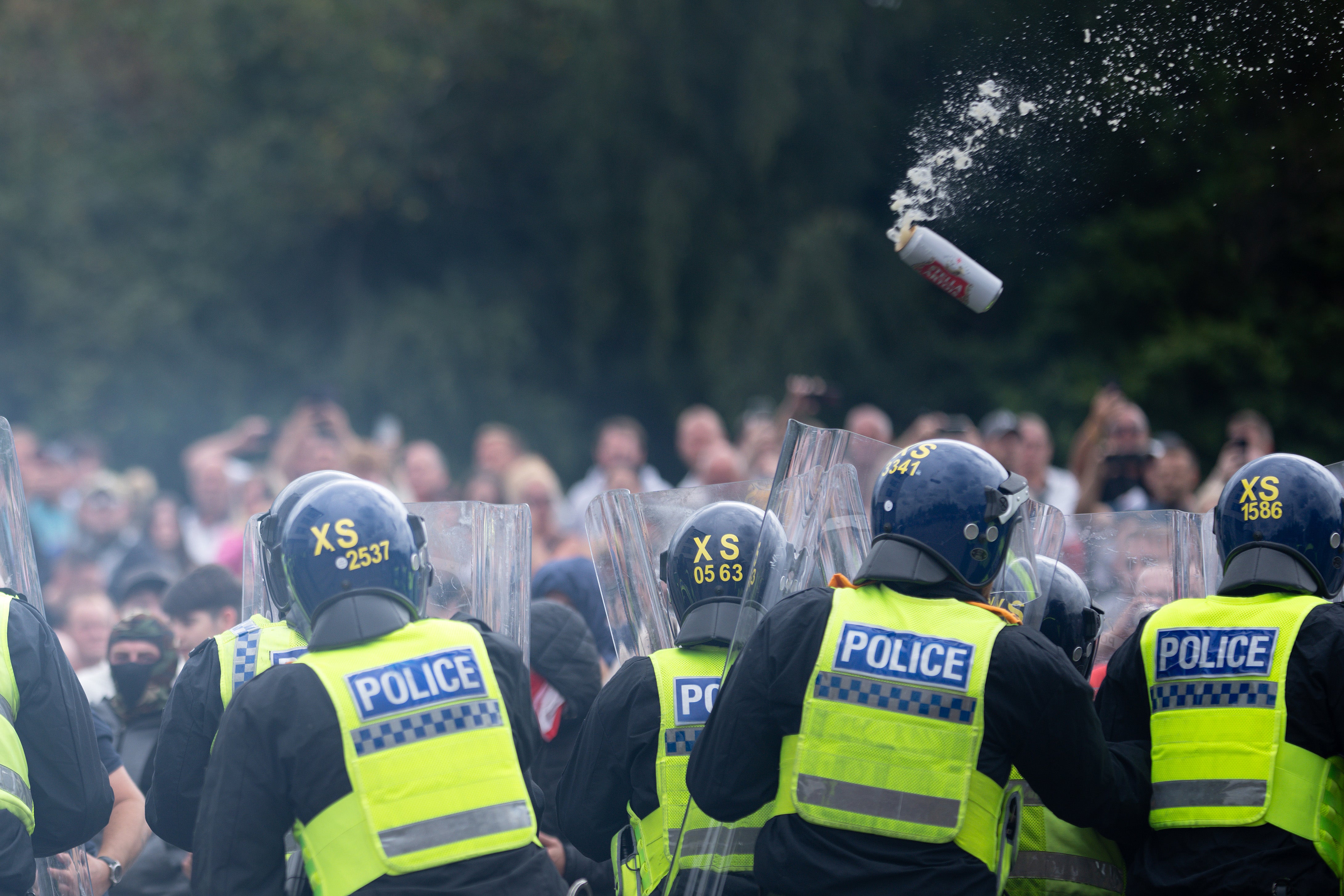 Riot police officers clashed with protesters outside the Holiday Inn Express Hotel housing asylum seekers in Rotherham on Saturday