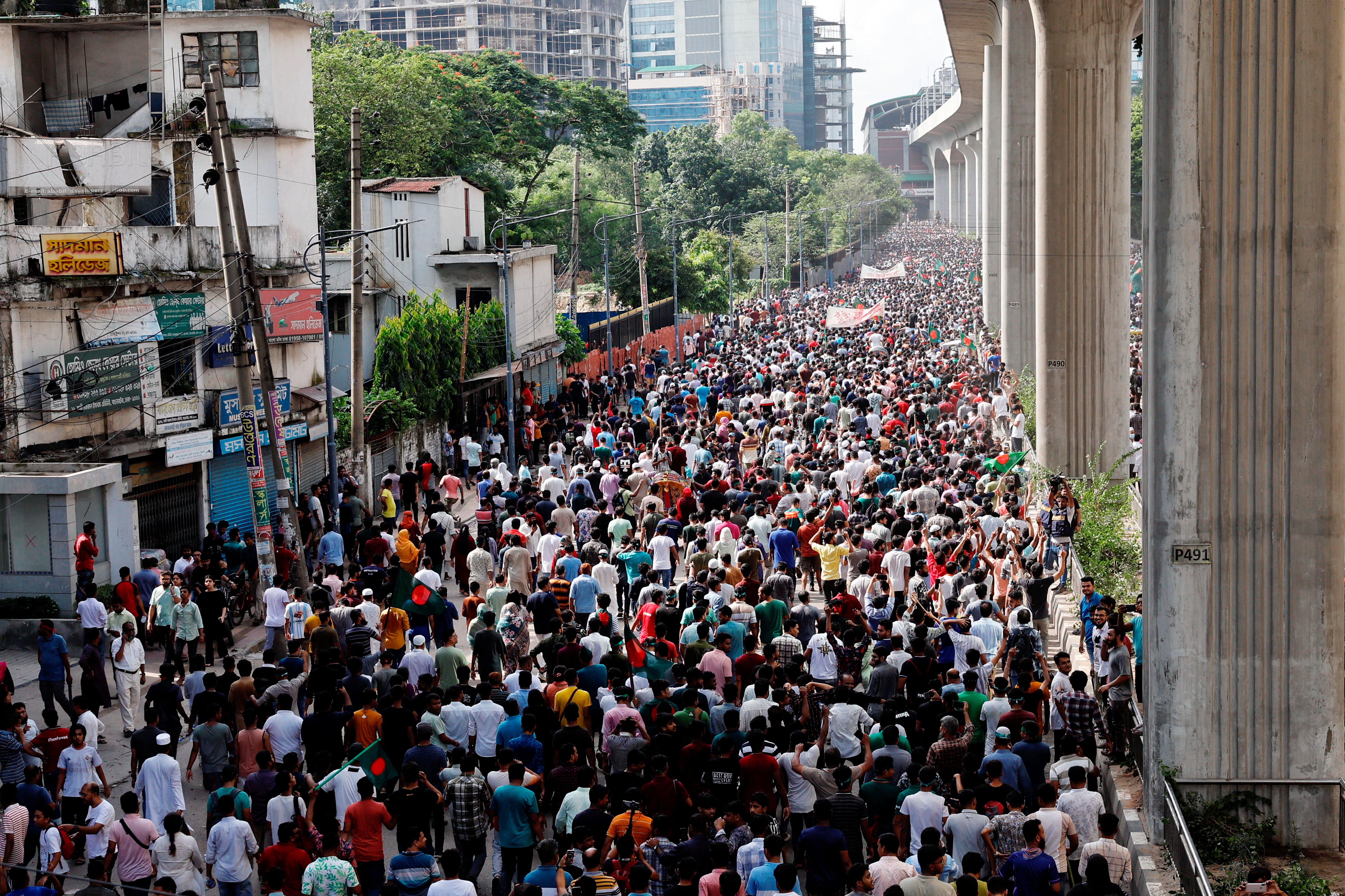 People celebrate the resignation of prime minister Sheikh Hasina in Dhaka