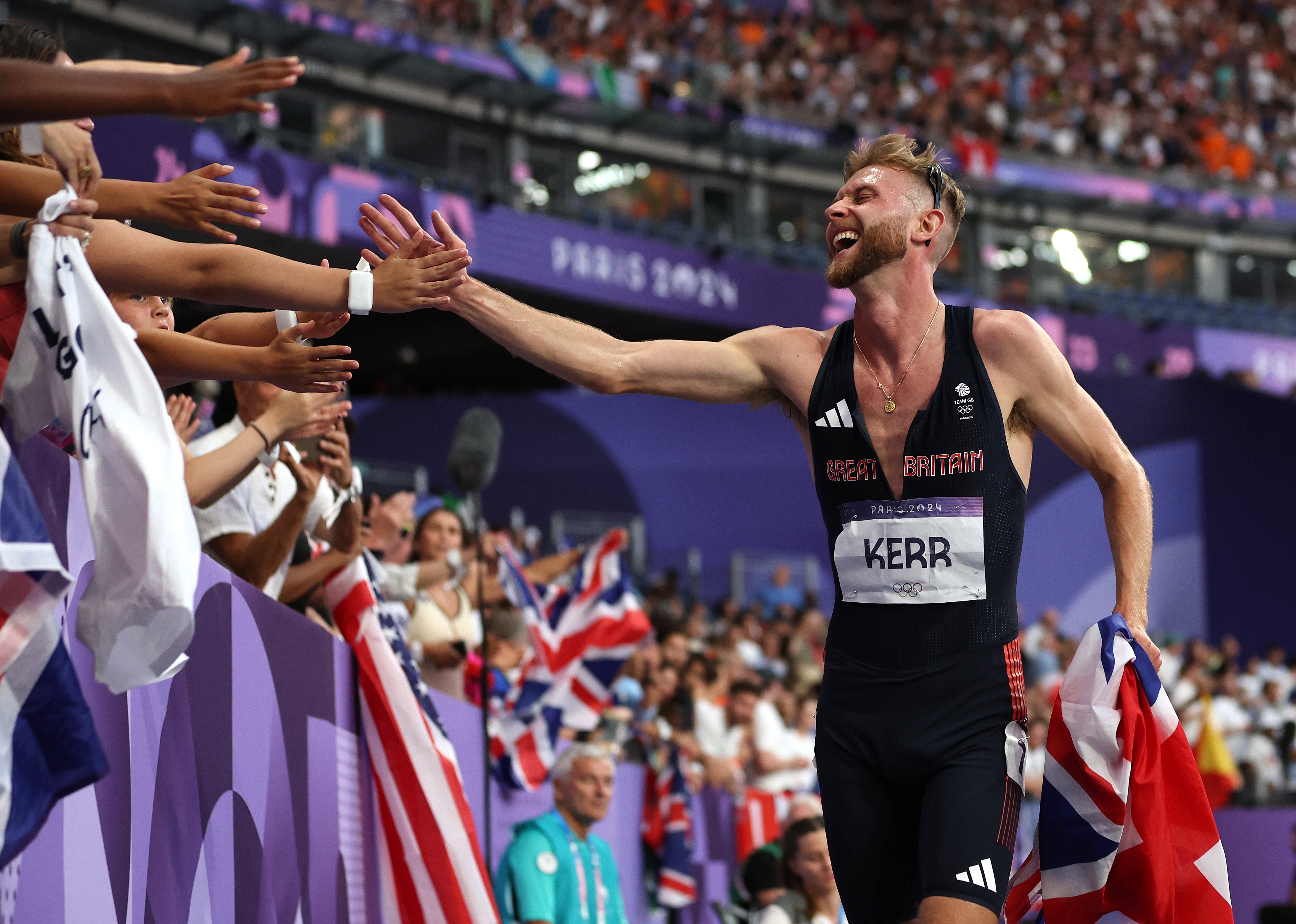 Kerr celebrates his silver-medal run with Team GB supporters in the Stade de France