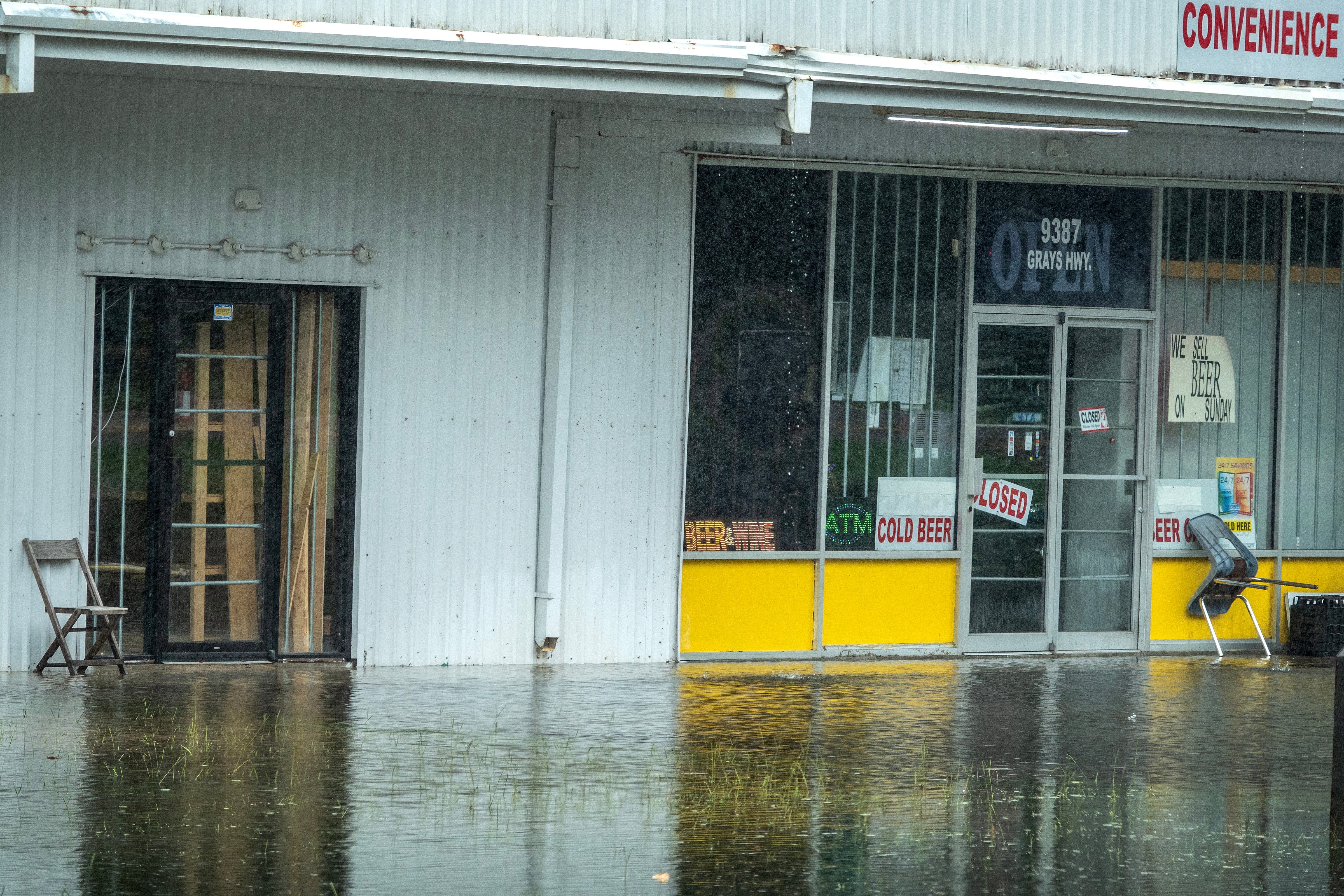 A closed store with a flooded front lot from Tropical Storm Debby in Ridgeland, South Carolina on Tuesday