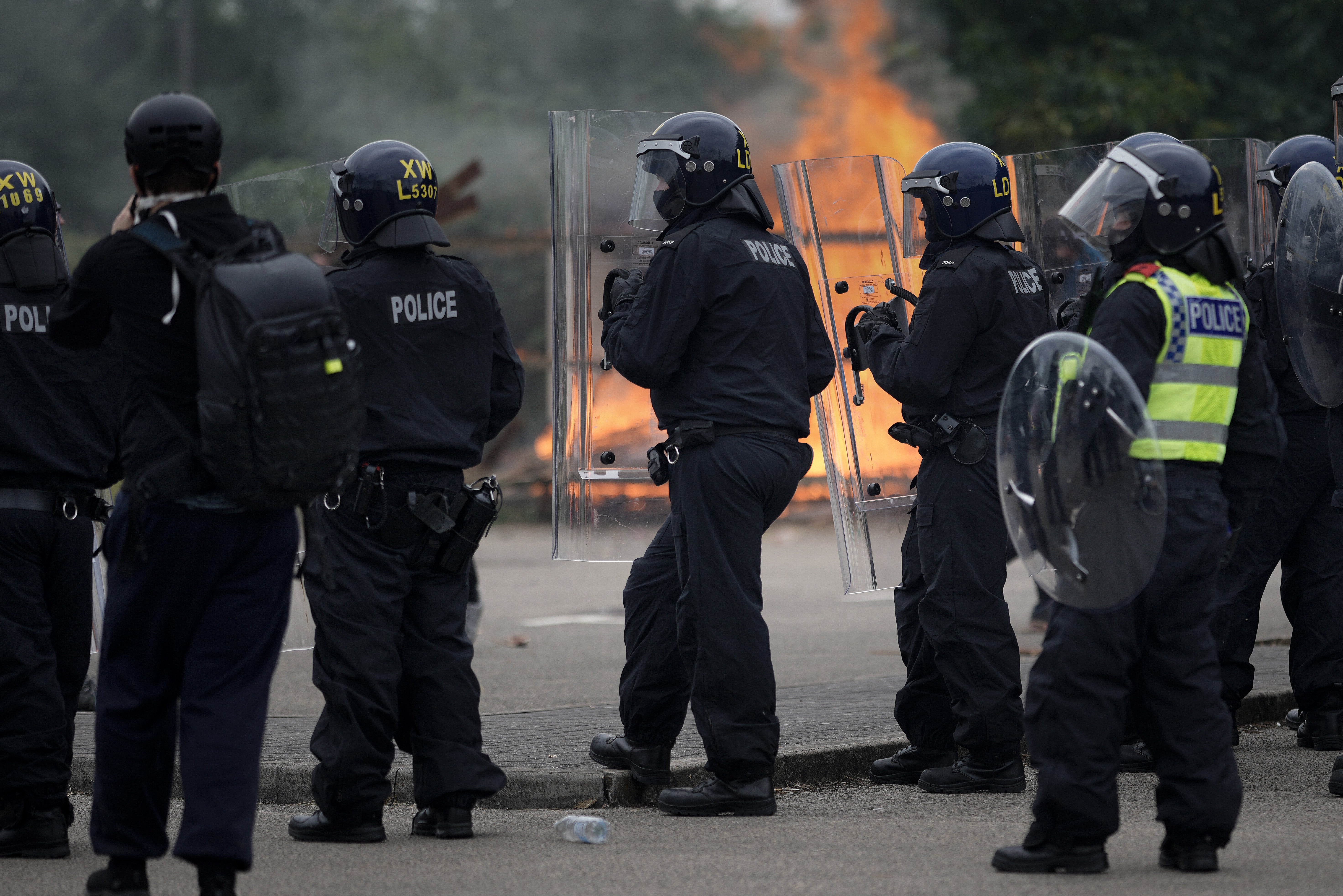 Police dealing with rioters during the incident outside Holiday Inn Express in Rotherham