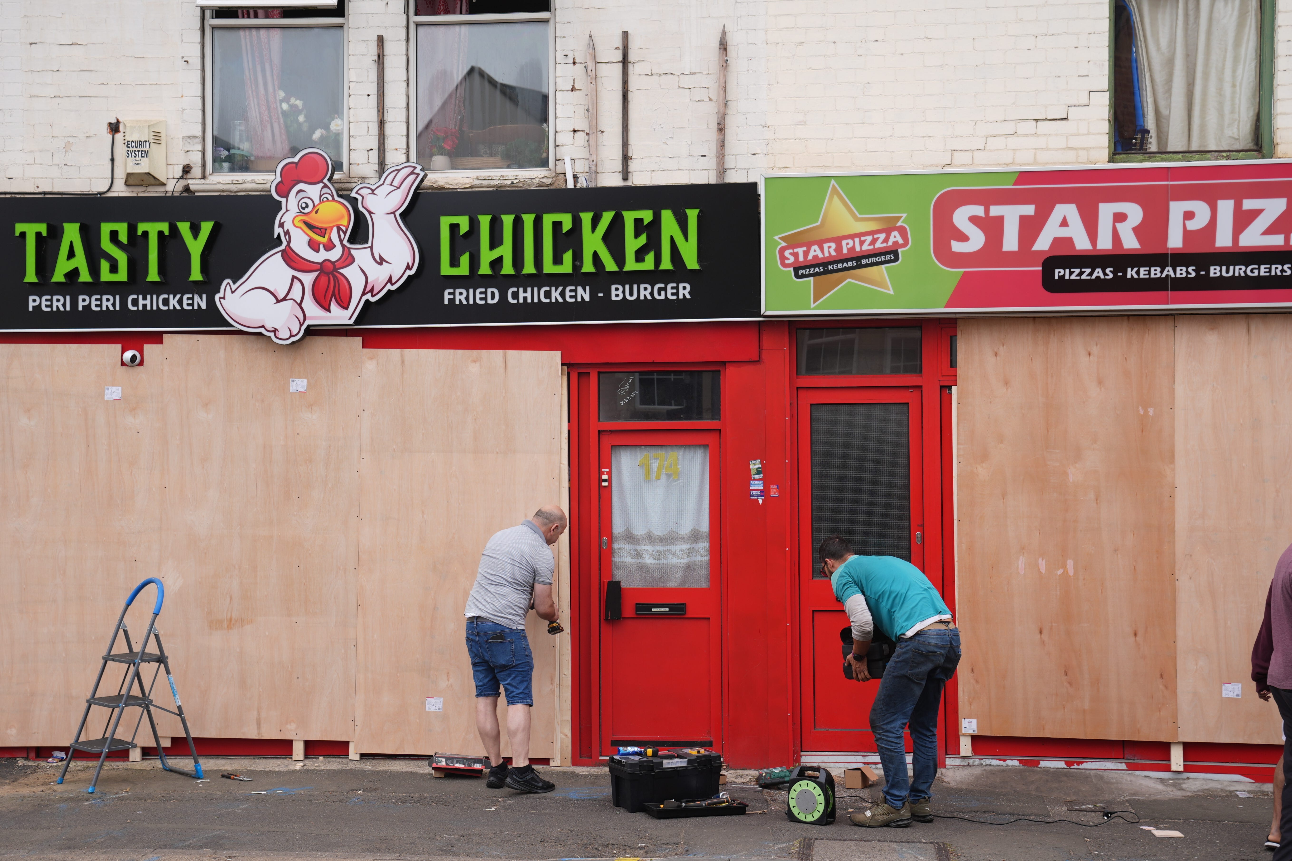 Shop fronts across the country have been boarded up ahead of planned disorder on Wednesday (Joe Giddens/PA)