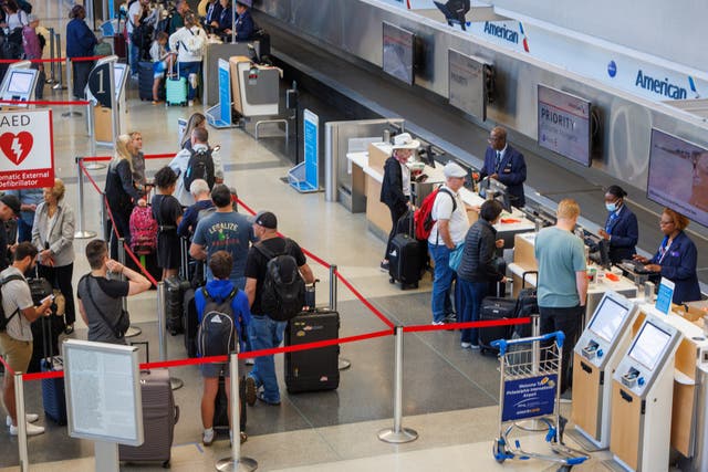 <p>Passengers wait in line at the Philadelphia International Airport on Monday as Tropical Storm Debby causes flight delays across the East Coast</p>