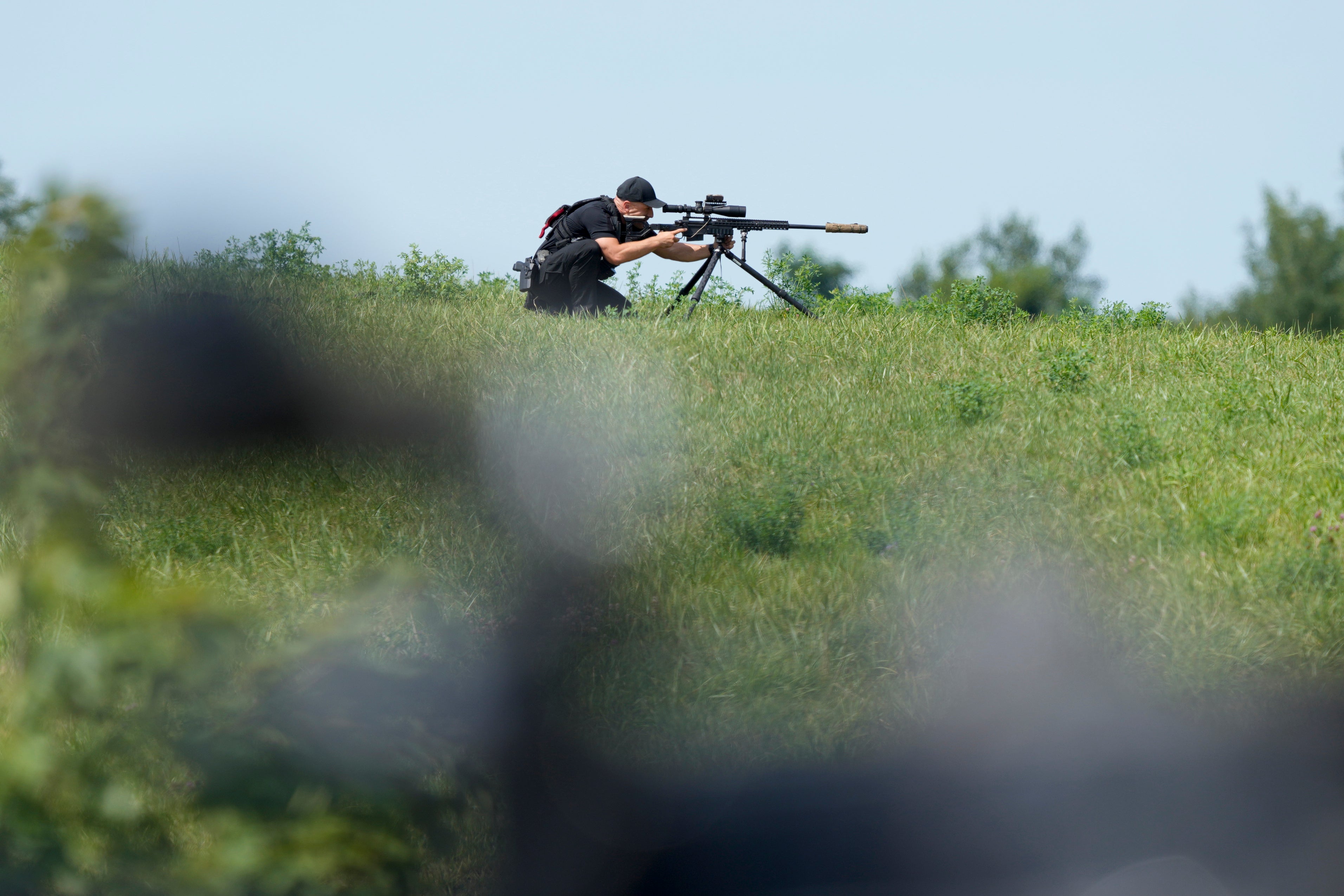 A Secret Service sniper is positioned next to a campaign event for Kamala Harris and Tim Walz in Eau Claire, Wisconsin on August 7.