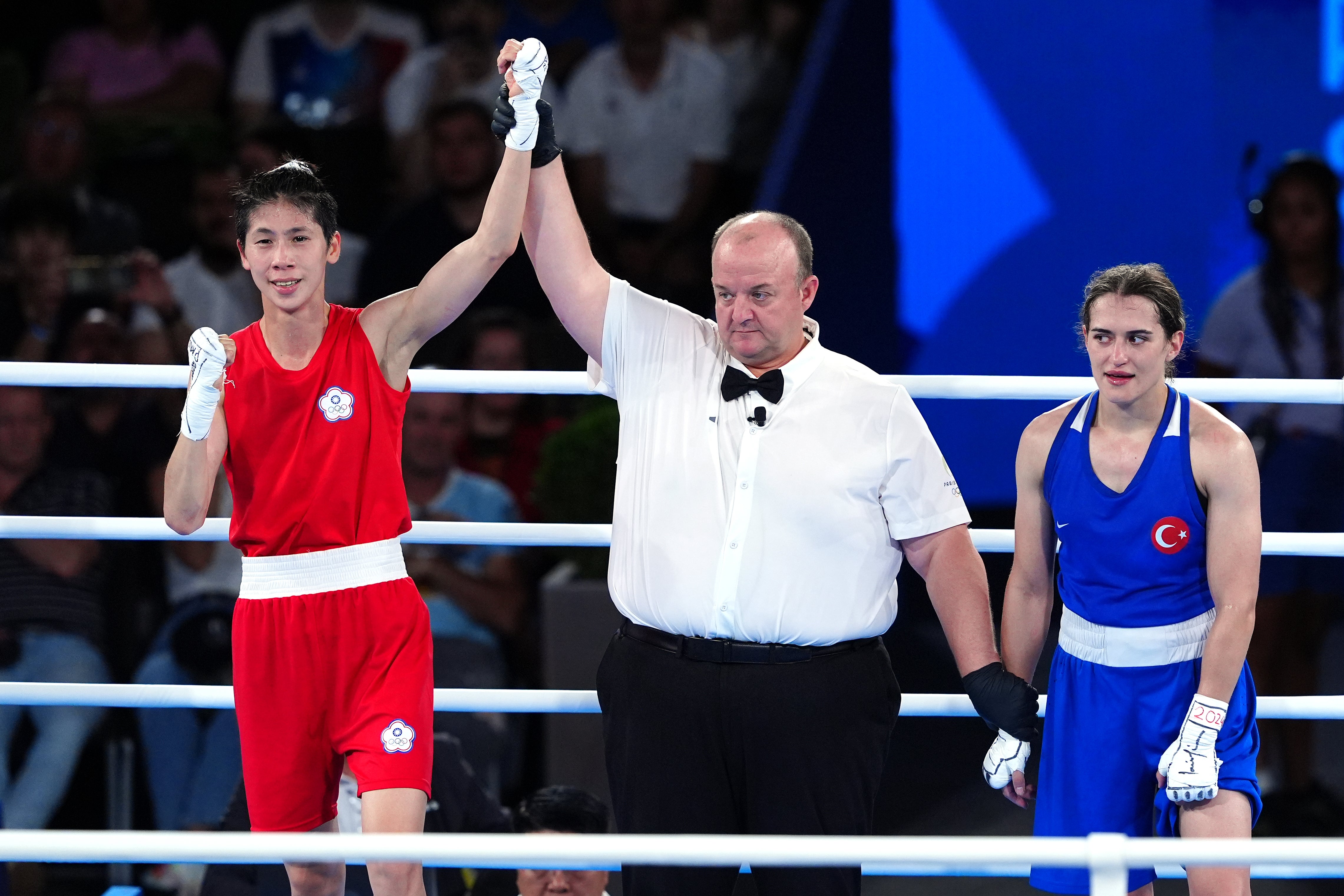 Lin Yu-ting’s hand was raised as the winner