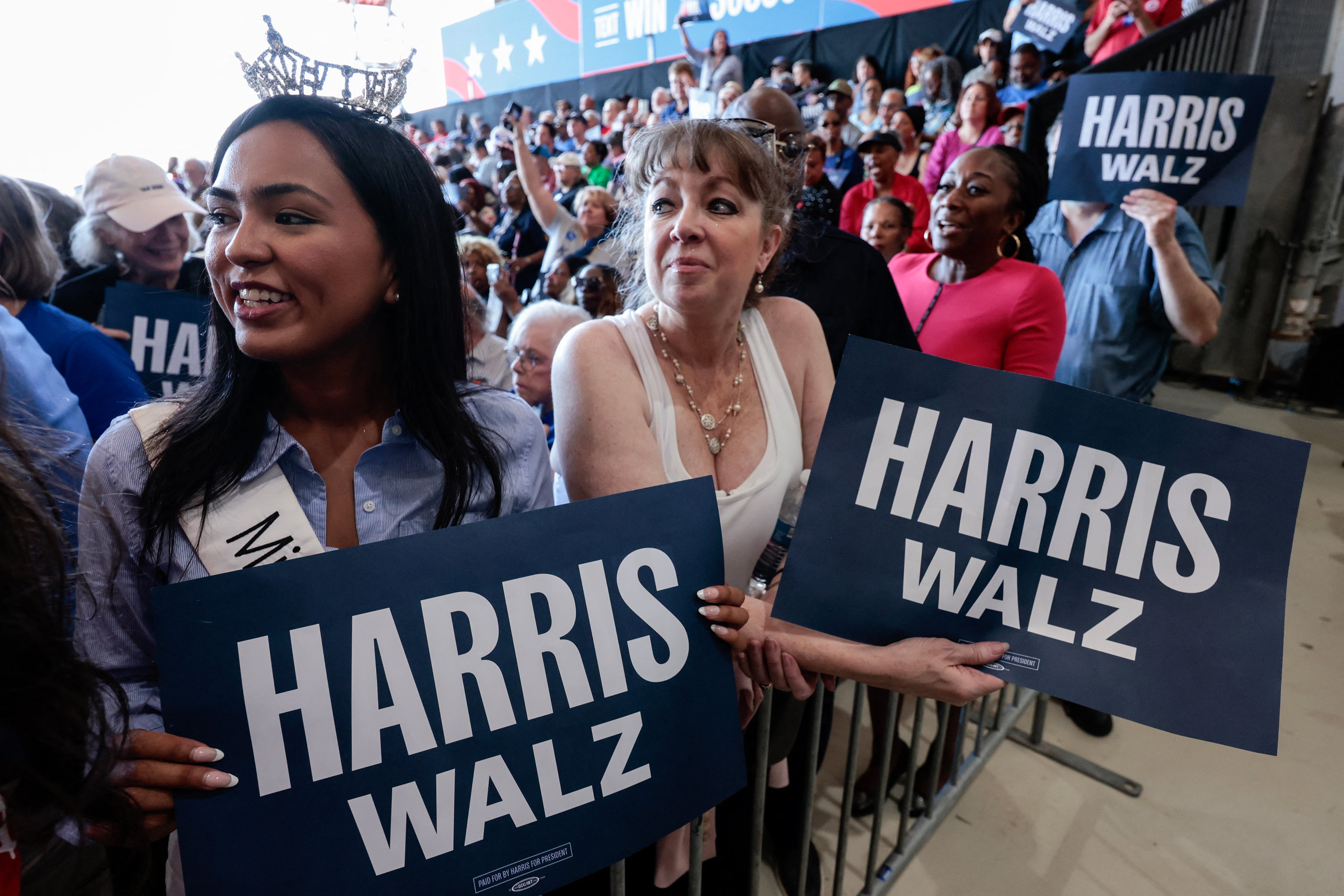 Supporters cheer on Harris and Walz at Detroit Metropolitan Airport in Romulus, Michigan, on August 7