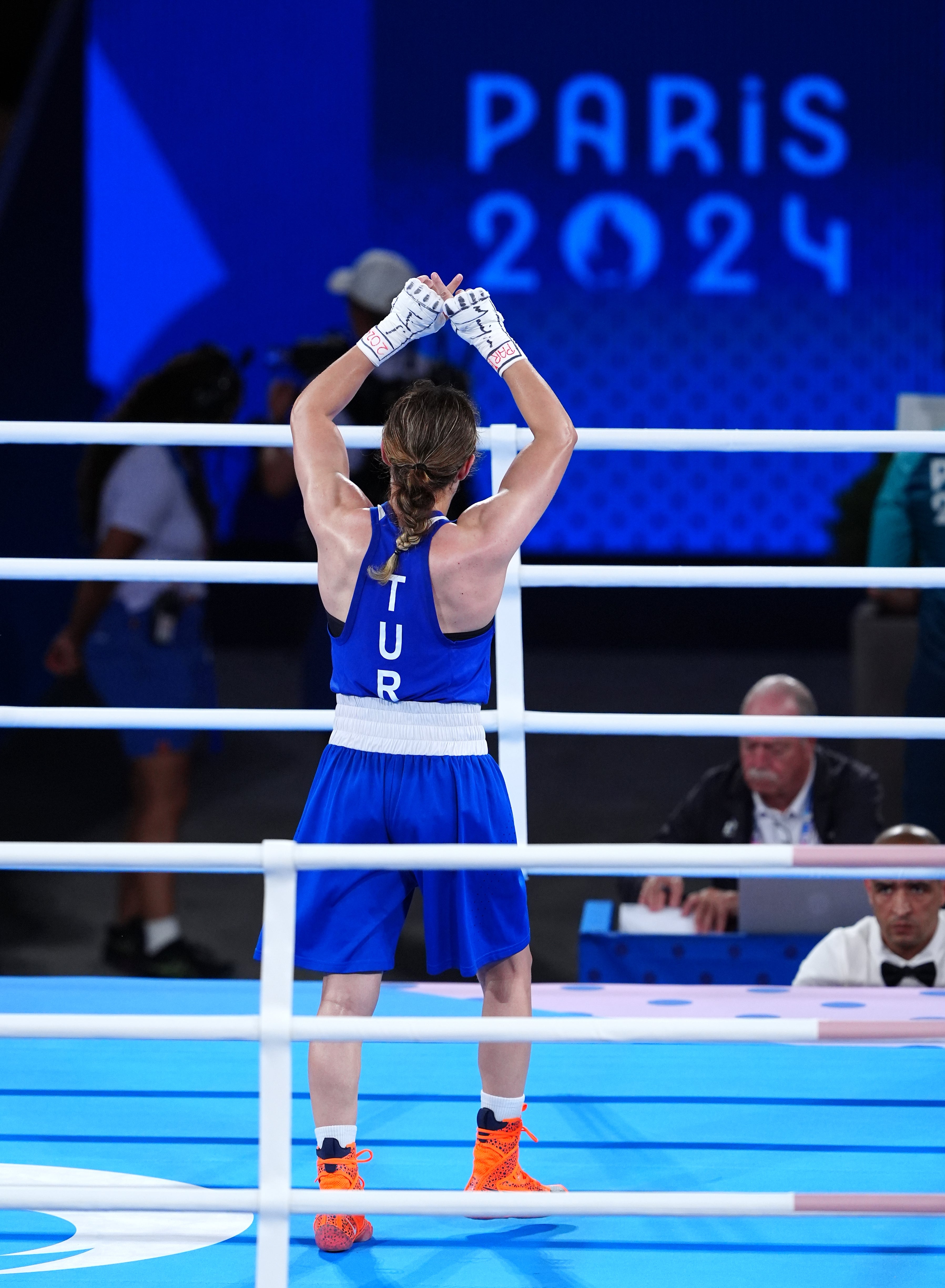 Turkey's Esra Yildiz Kahraman does an 'X' sign with their hands