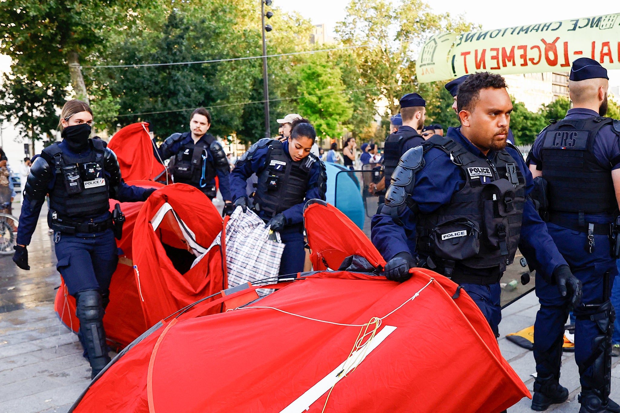 Police at the Bastille clear tents belonging to protesters against the housing crisis