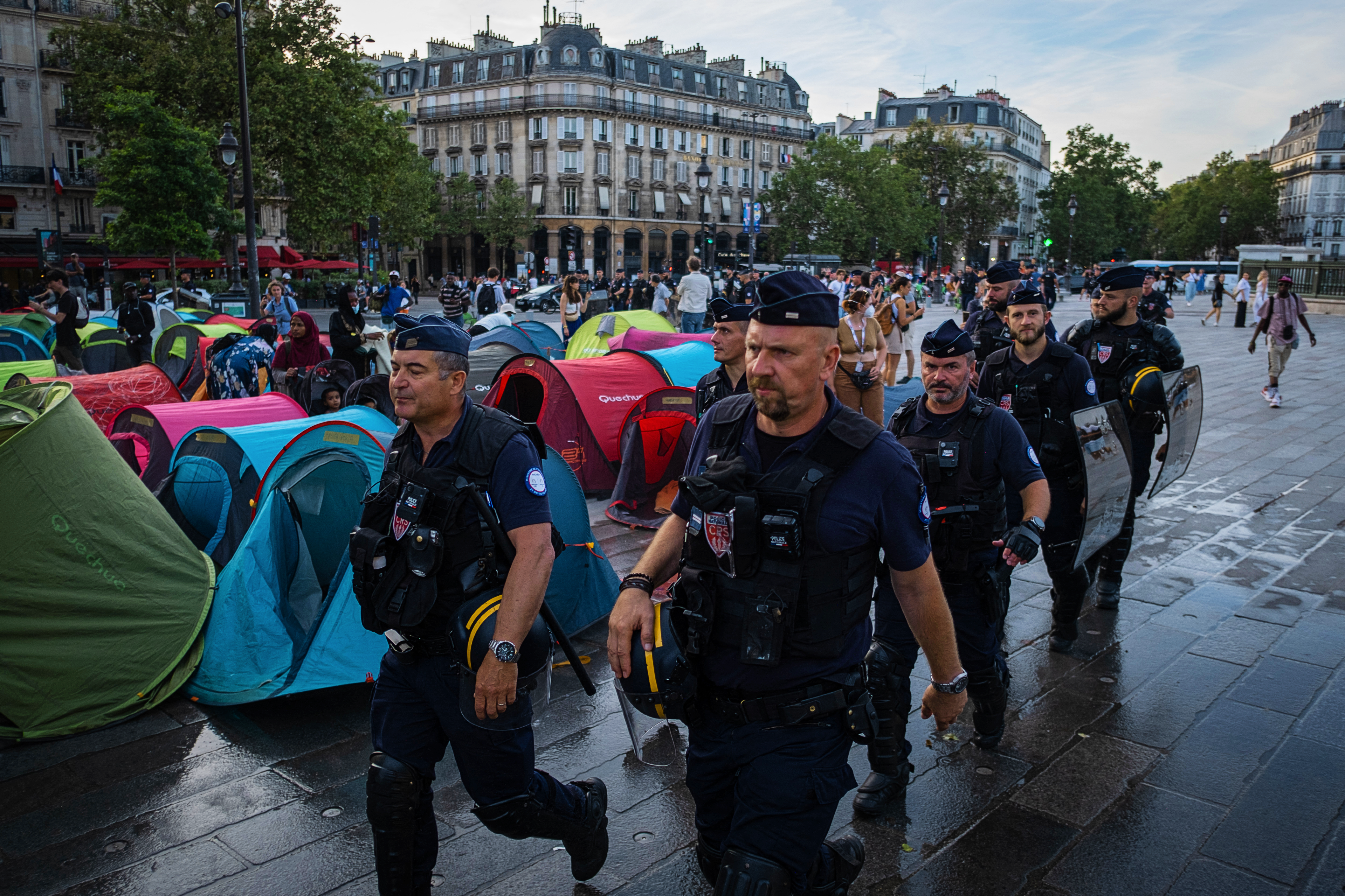 Police arrive at the Bastille to clear a protest against the crisis