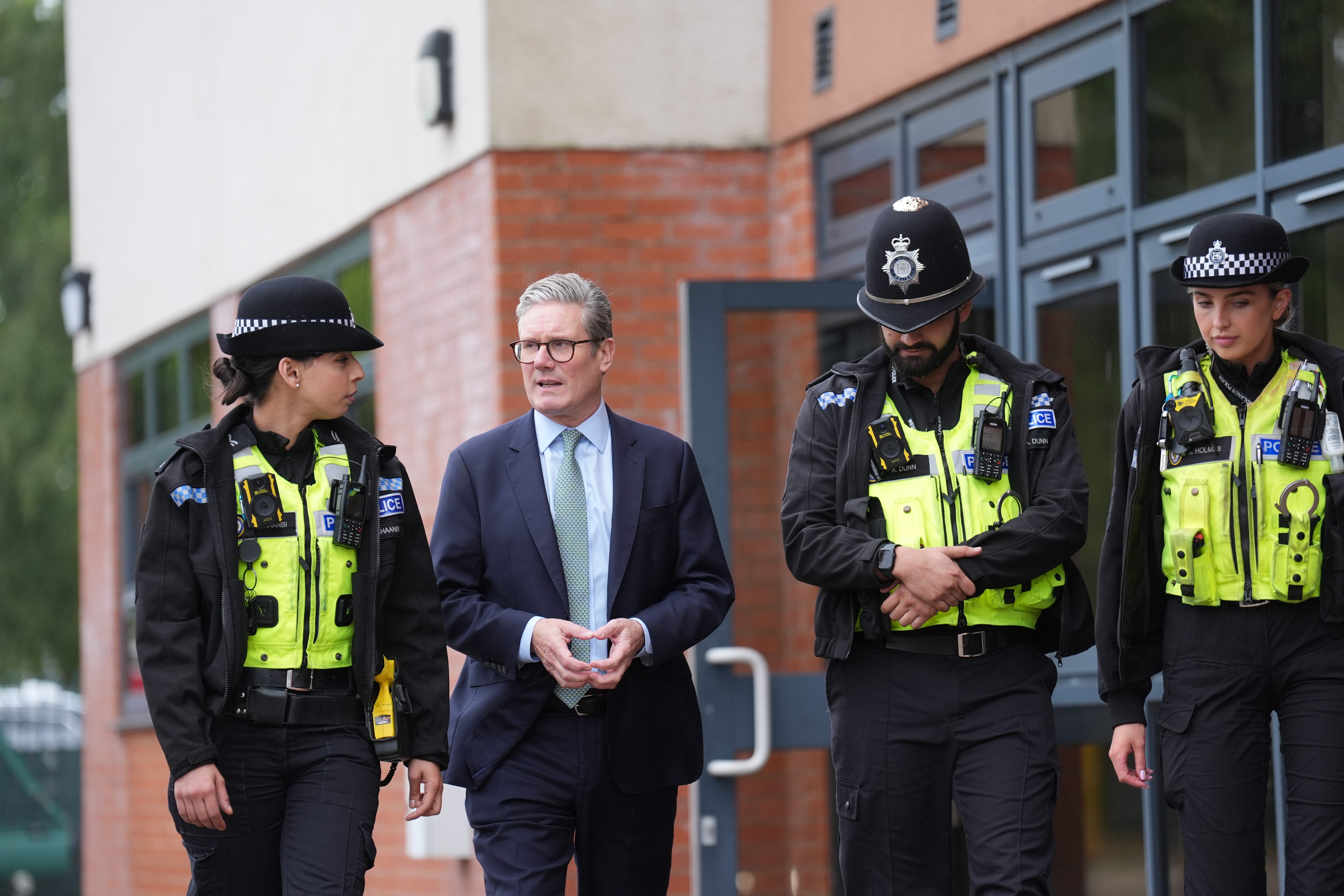 Sir Keir Starmer speaks with members of the West Midlands Police Force at Arden Academy in Solihull (Joe Giddens/PA)