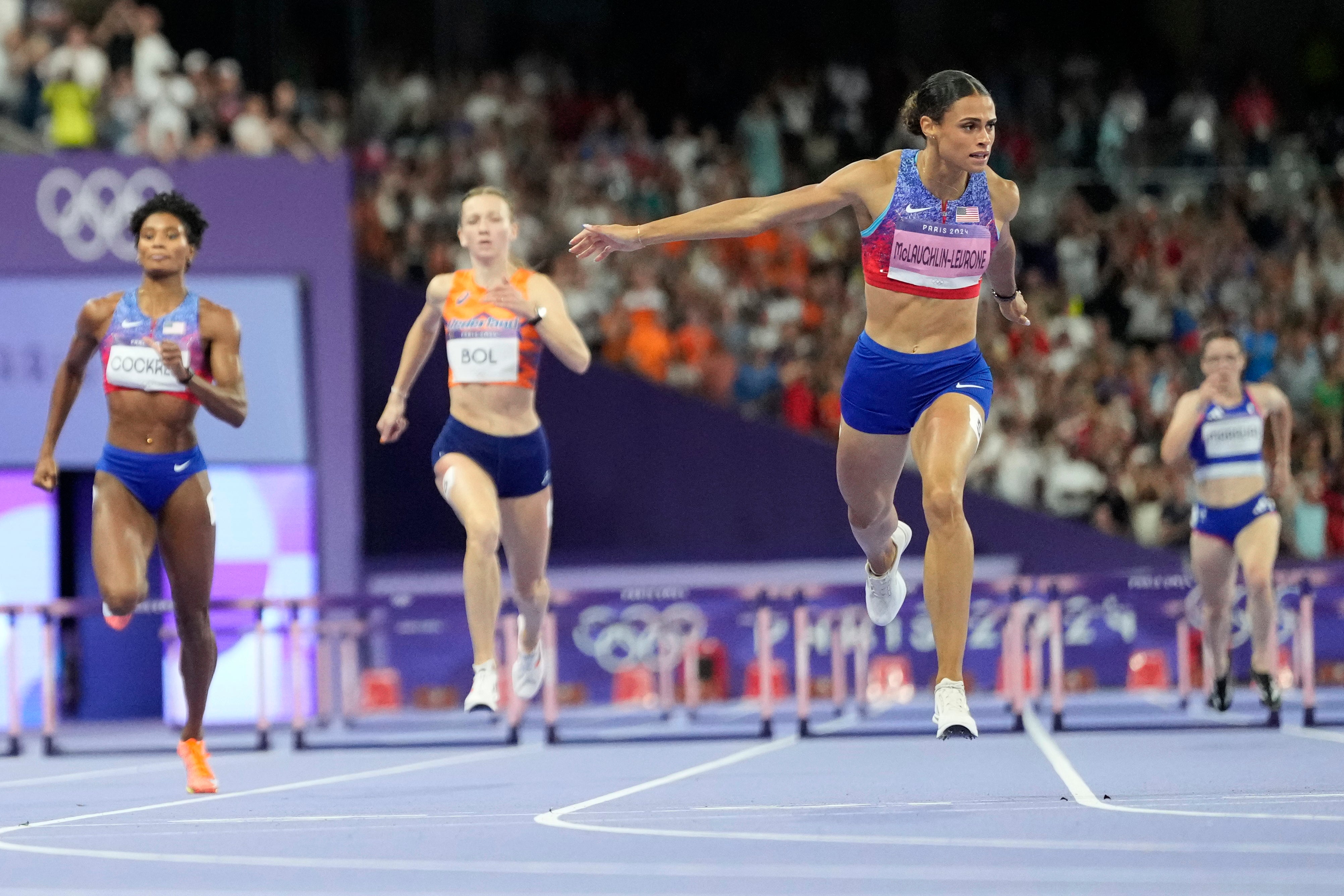 Sydney McLaughlin-Levrone crosses the line to win gold