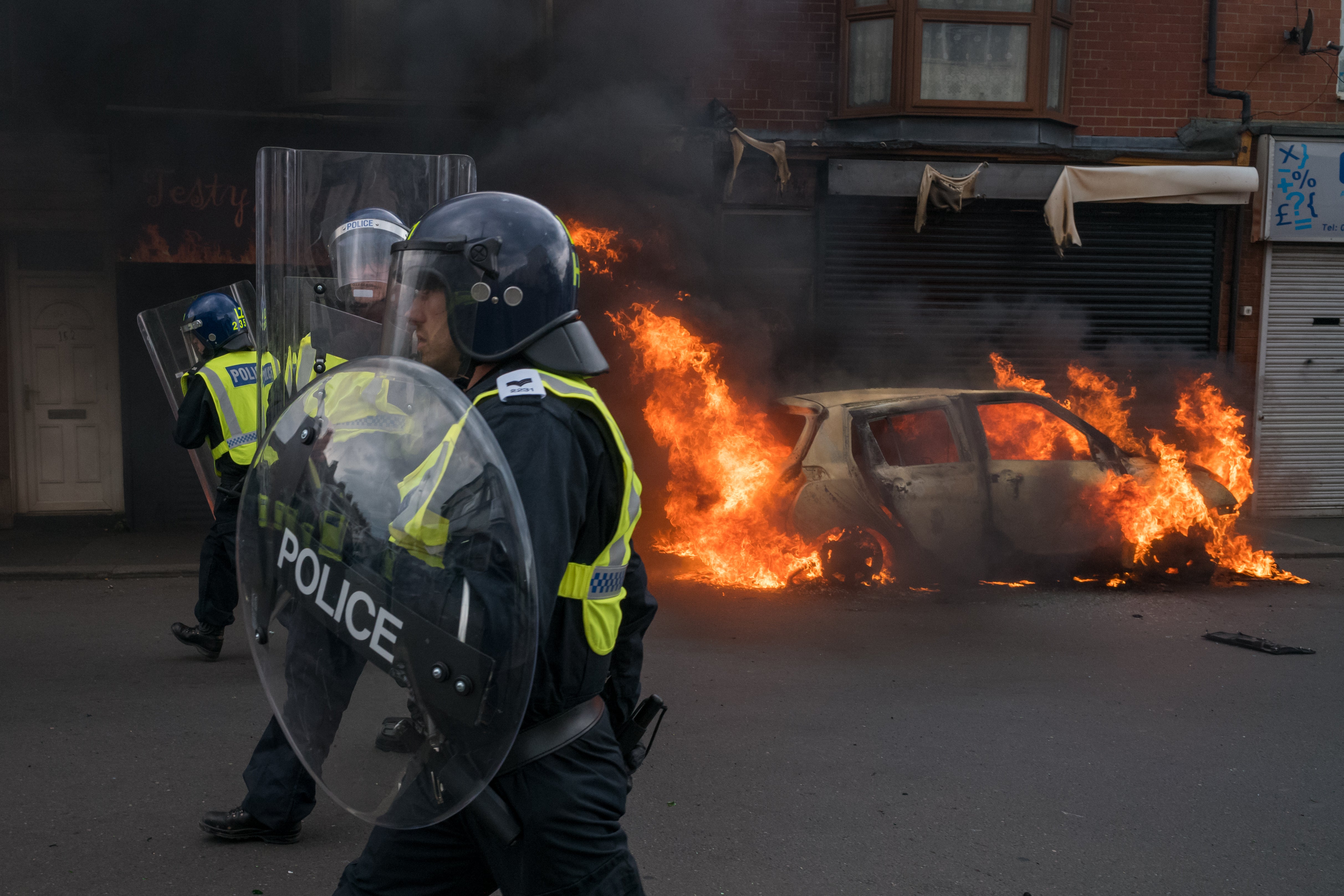 A car burns on Parliament Road after it was set alight by far-right activists holding a demonstration in Middlesbrough