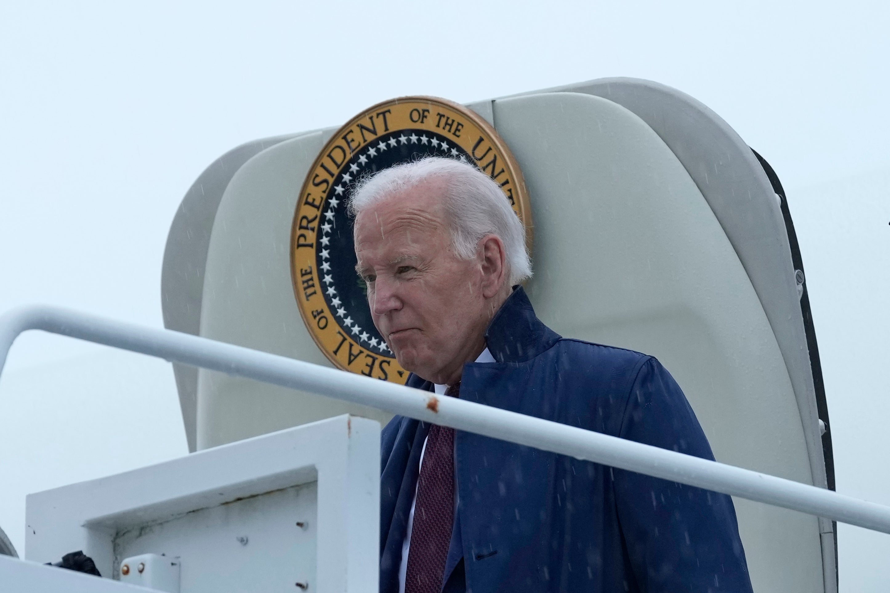 President Joe Biden walks down the steps of Air Force One at Delaware Air National Guard Base in New Castle, Del., Thursday, Aug. 8, 2024, to attend an event to thank his campaign staff