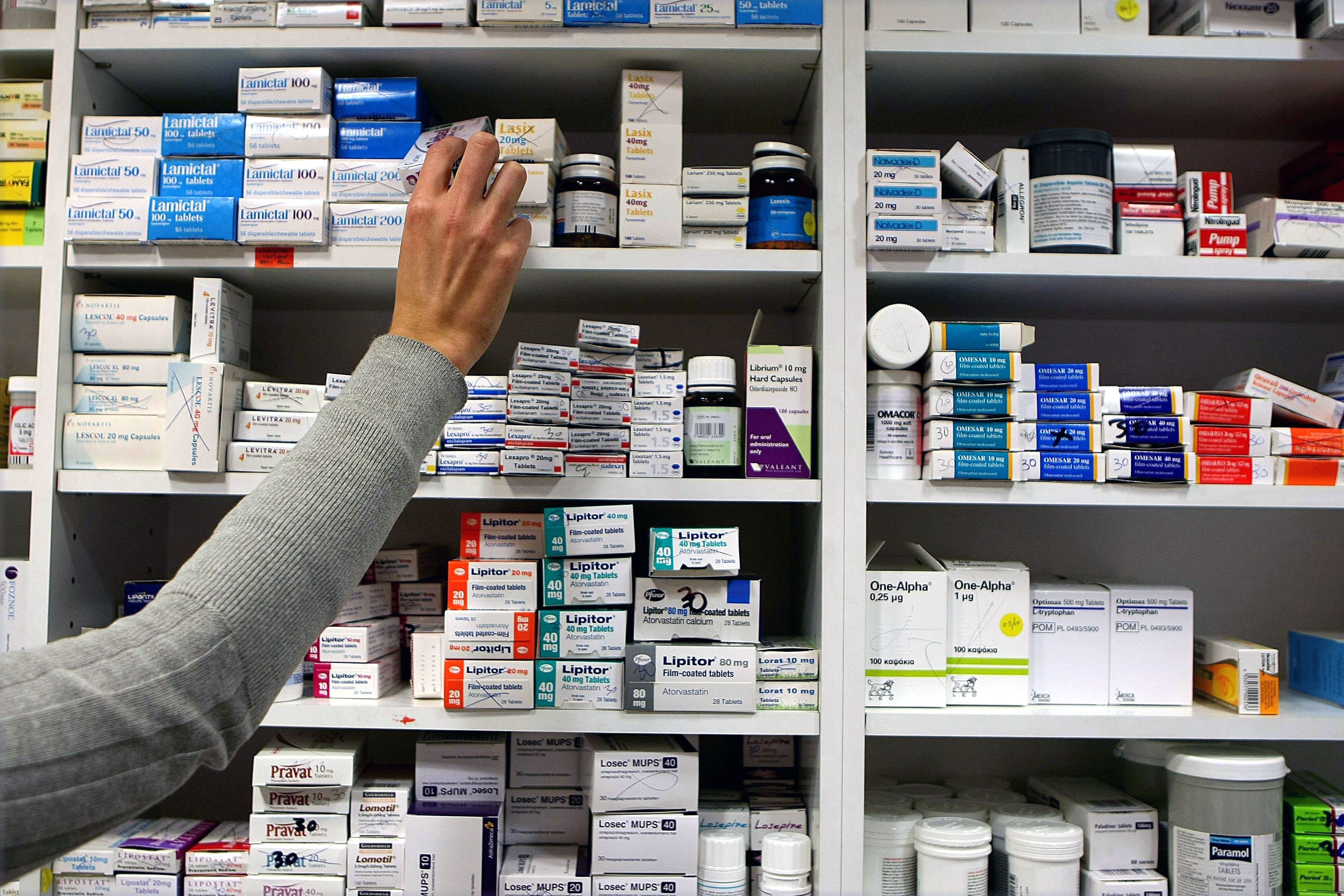 File photo dated 16/11/09 of a pharmacist stocking shelves at a chemist.