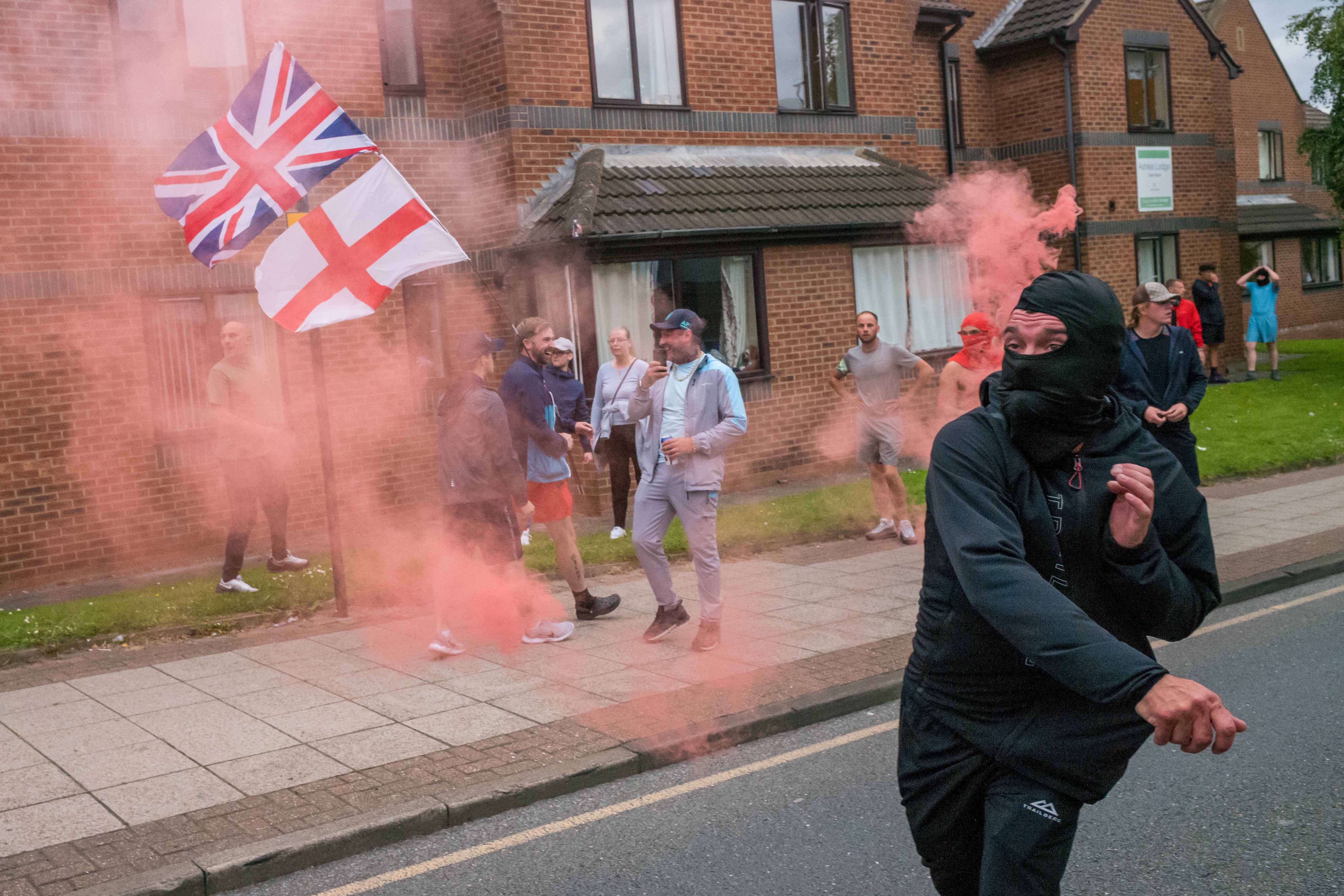 A rioter in Sunderland hurls a smoke bomb at police. Plans for violent gathering are often shared on Telegram as it offers high levels of secrecy