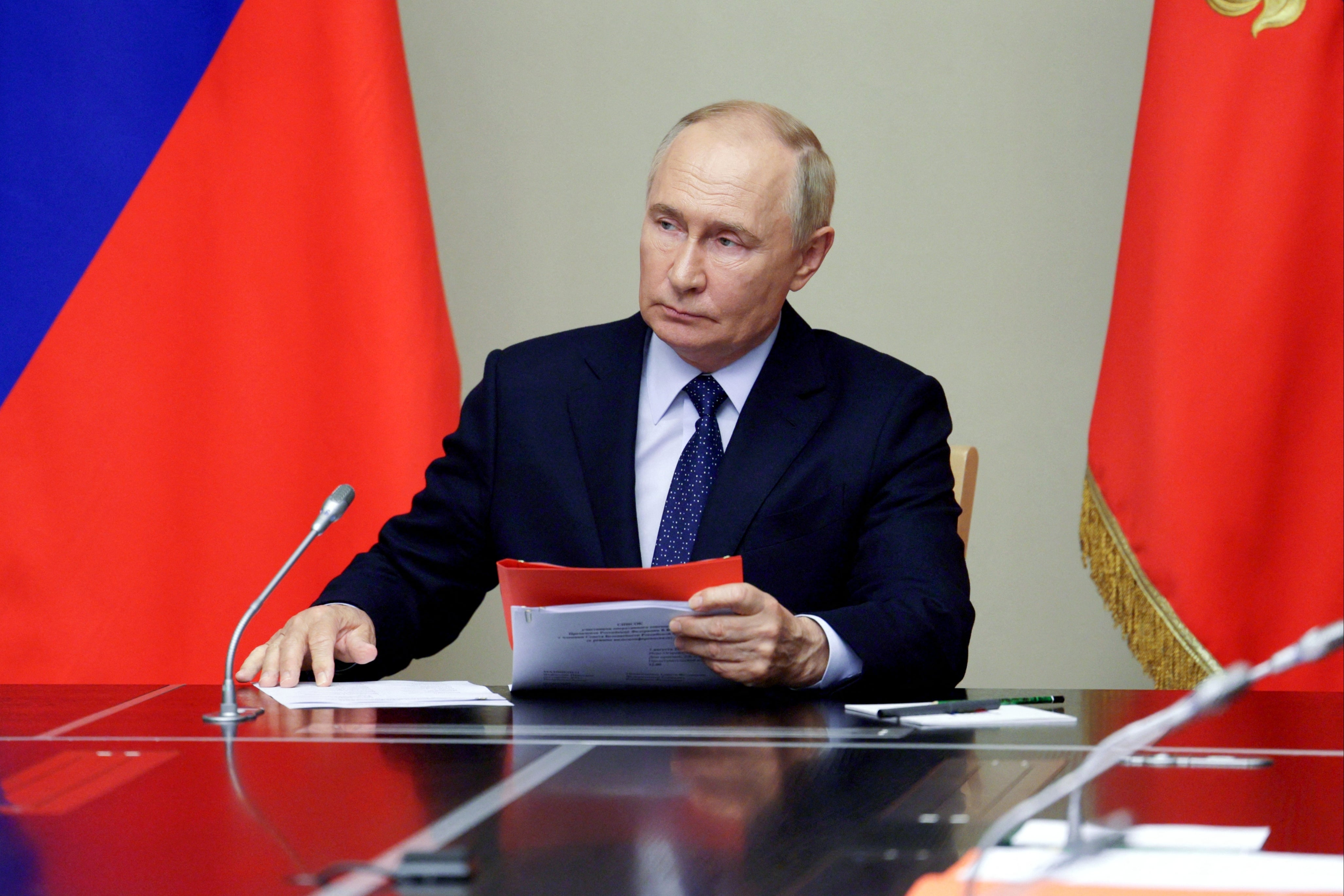 President Vladimir Putin chairs a meeting with Security Council in Moscow on Friday